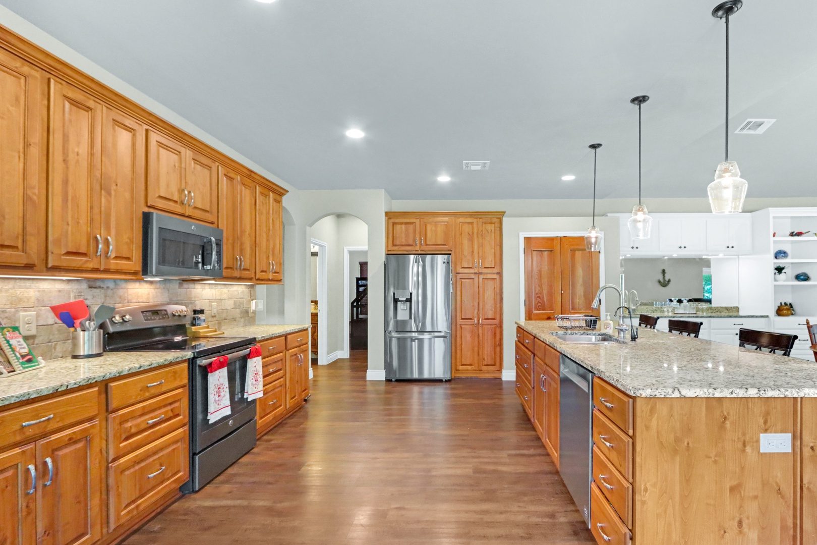 The open, updated kitchen offers ample space & all the comforts of home