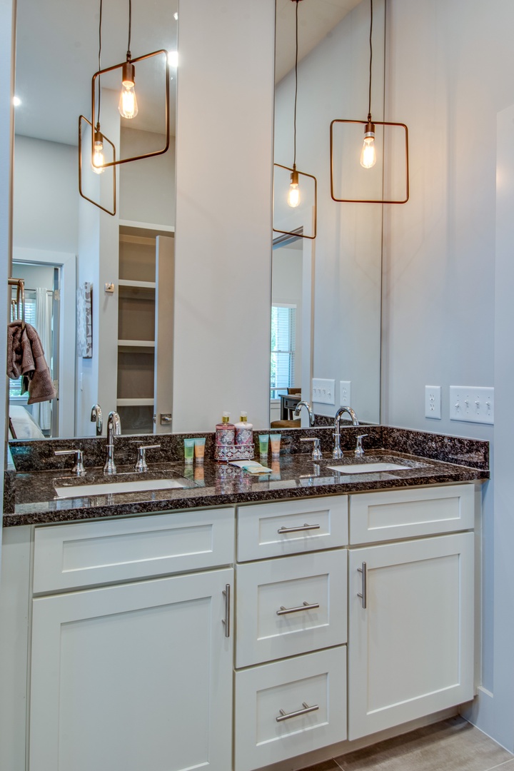 Unit B- En suite bathroom with dual sinks and standing shower