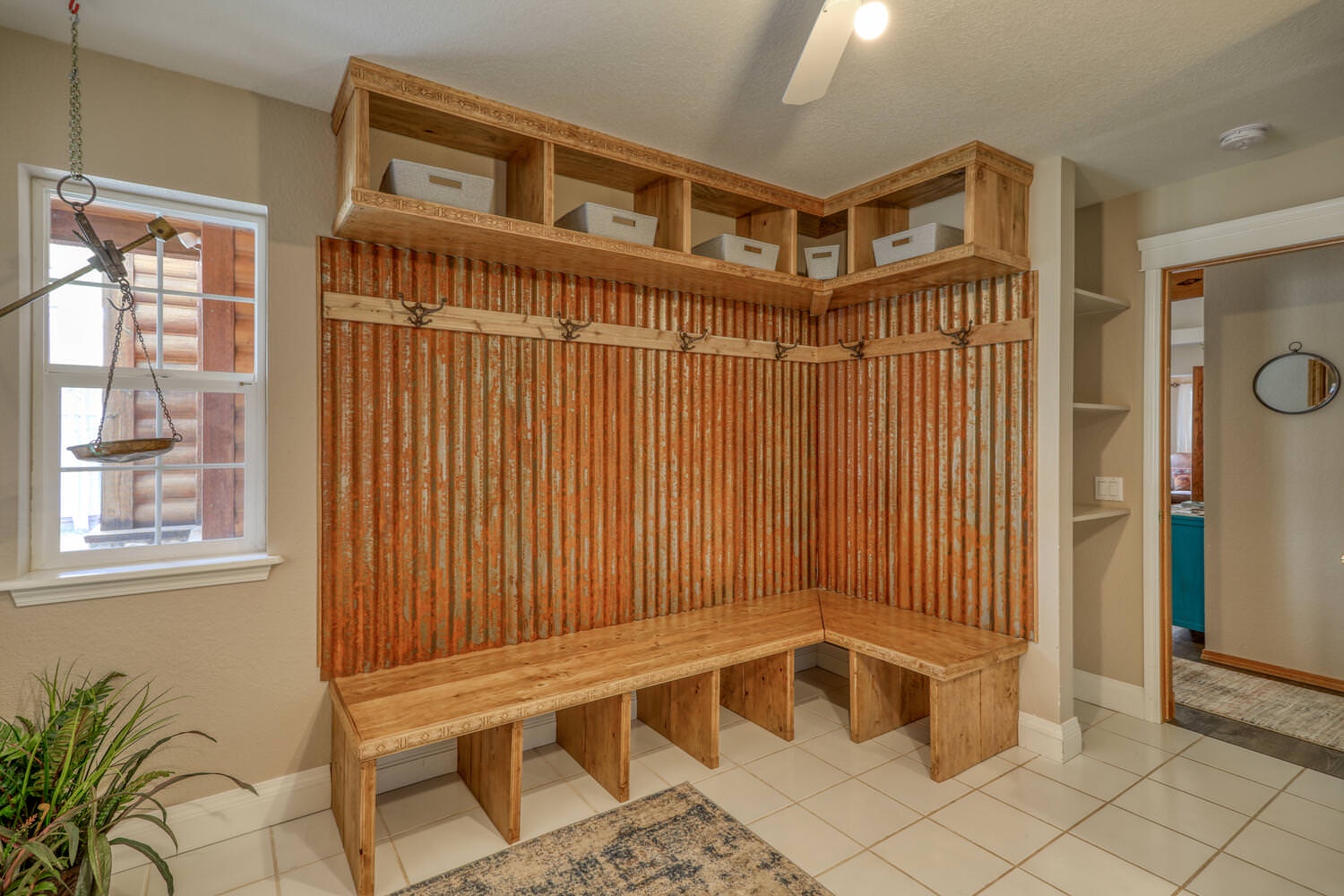 Mudroom with seating and lots of hooks