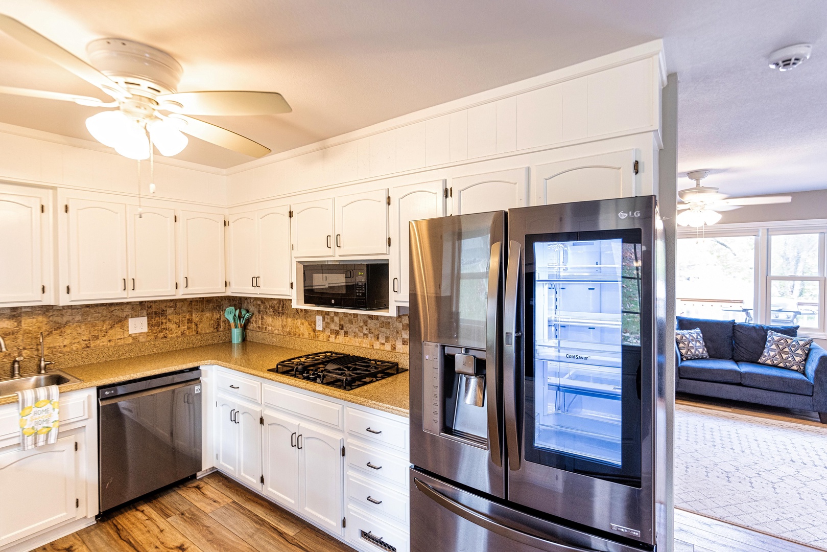 The kitchen offers ample space & all the storage of home