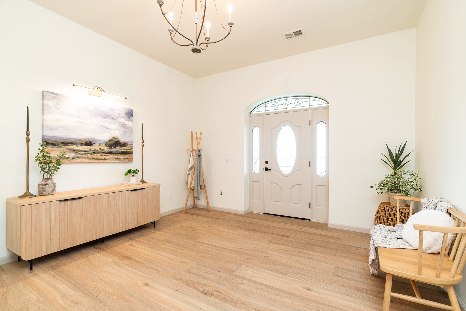 A spacious, breezy foyer will welcome you home