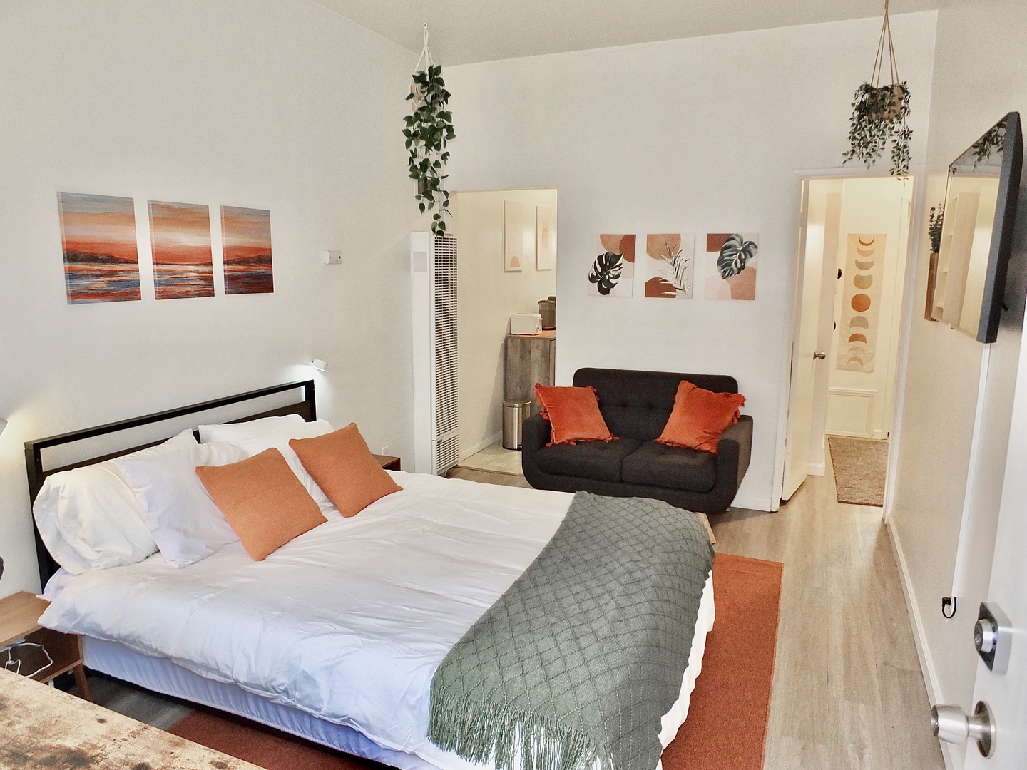 This comfy studio apartment offers a queen bed, Smart TV, & full kitchen