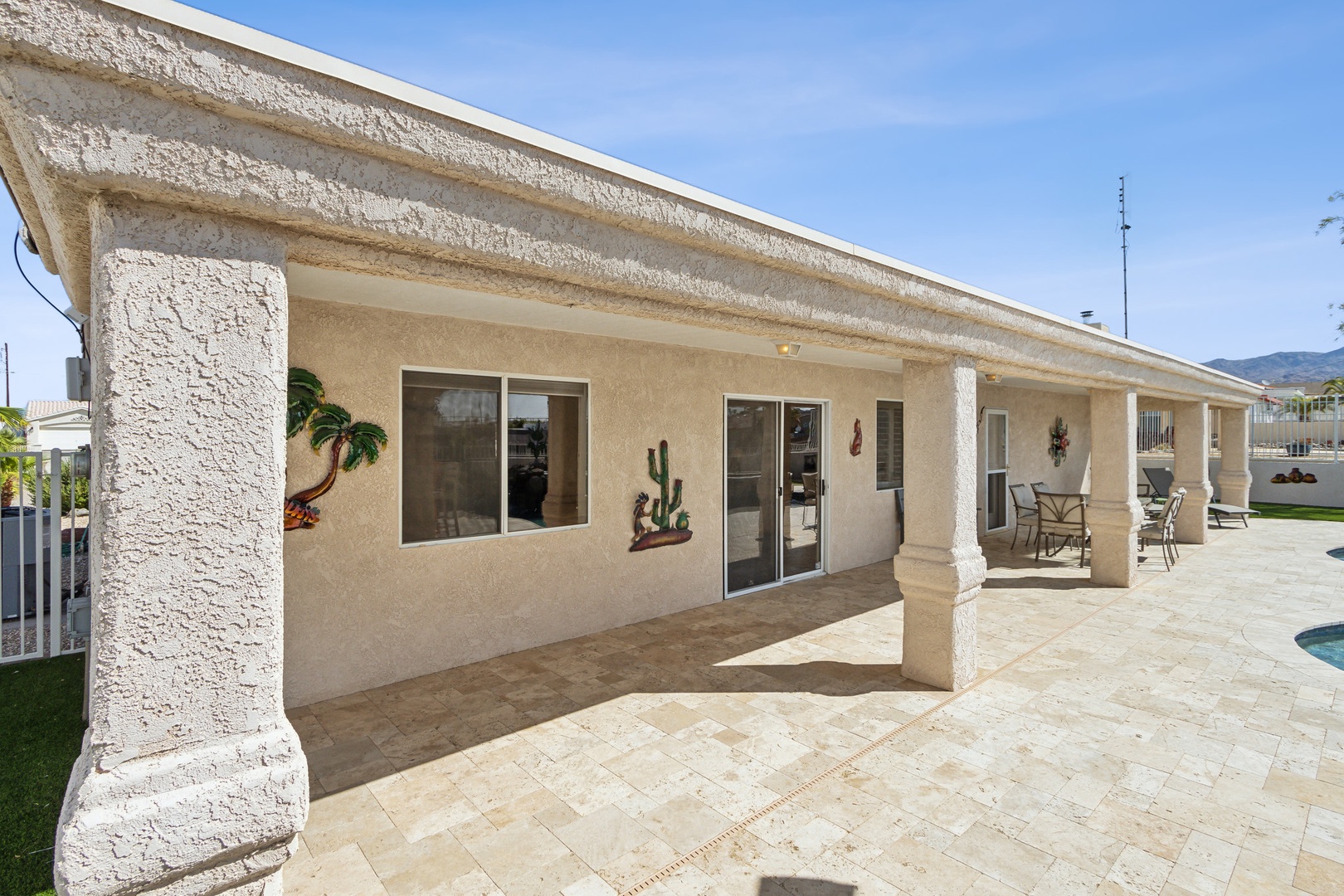 A mountain-view oasis, with a waterfall pool, hot tub, & outdoor kitchen!