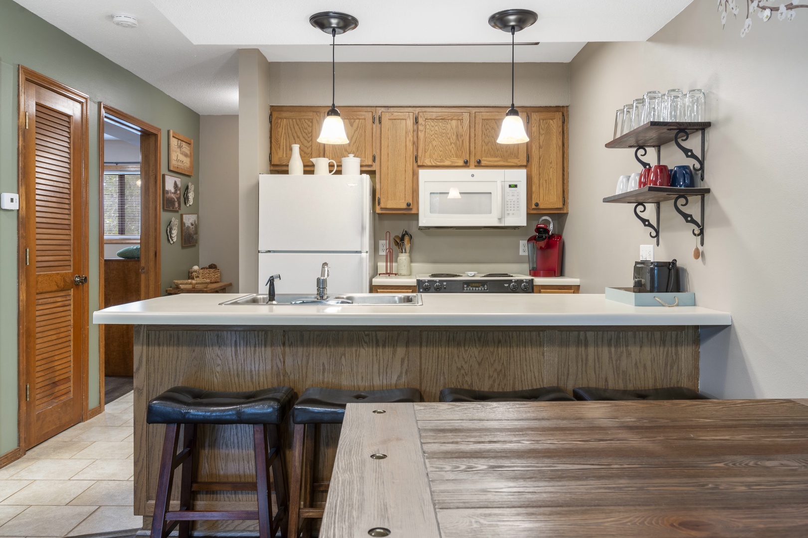 The open, airy kitchen offers ample space & all the comforts of home