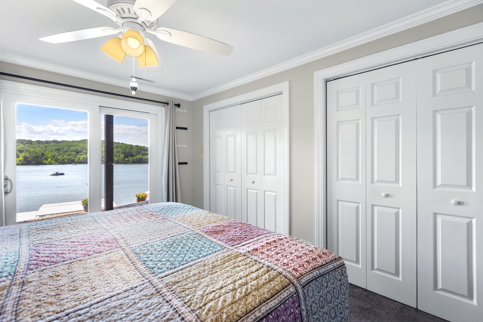 The lower-level suite boasts a king bed, ensuite bath & patio access