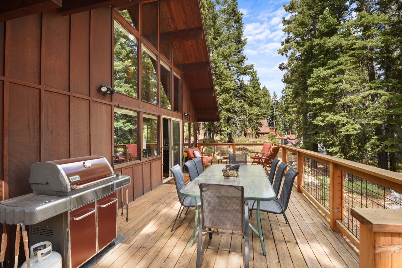 Deck with dining table for 8, grill, and additional lounging space