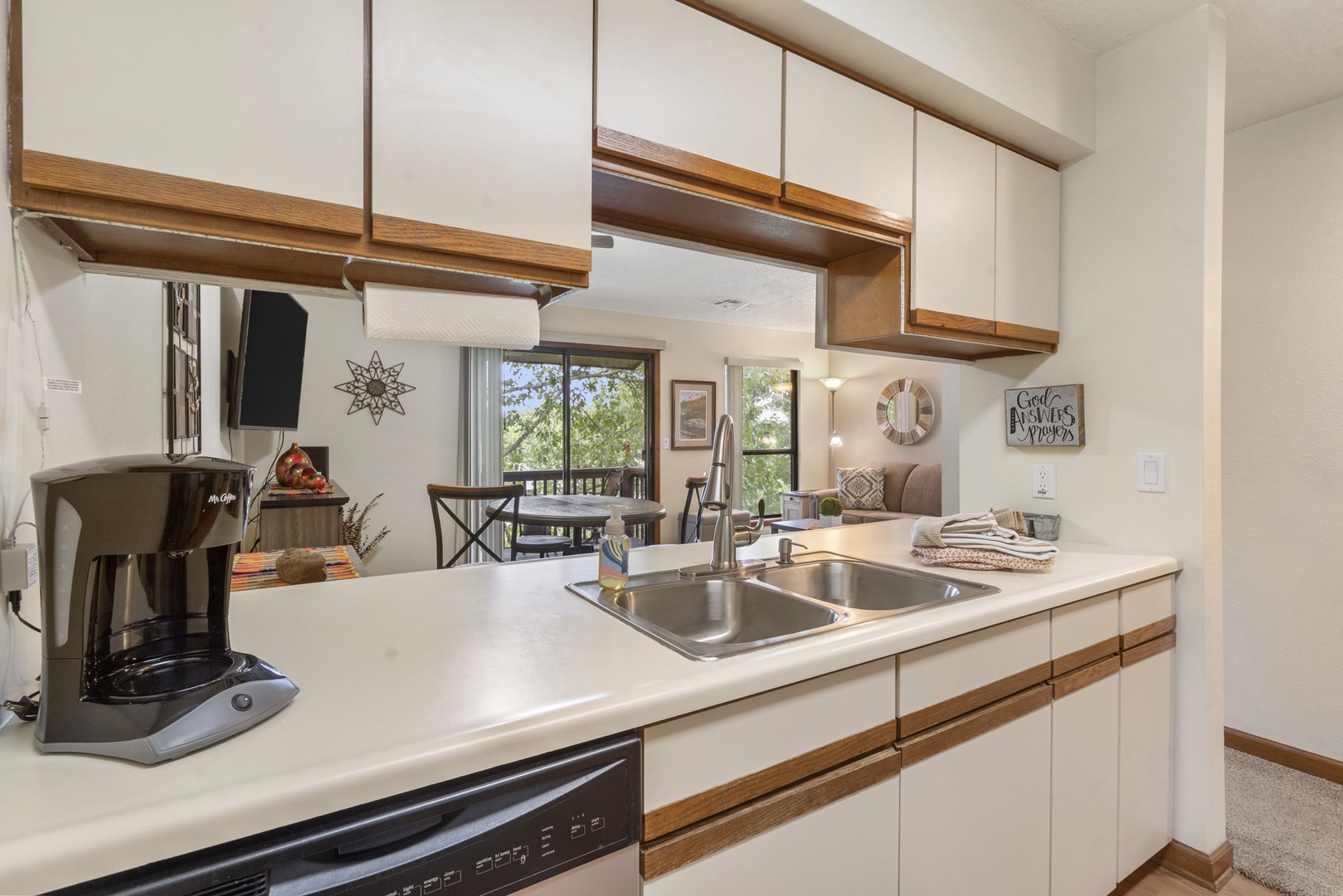 Head into the open kitchen, offering ample storage space & lots of amenities