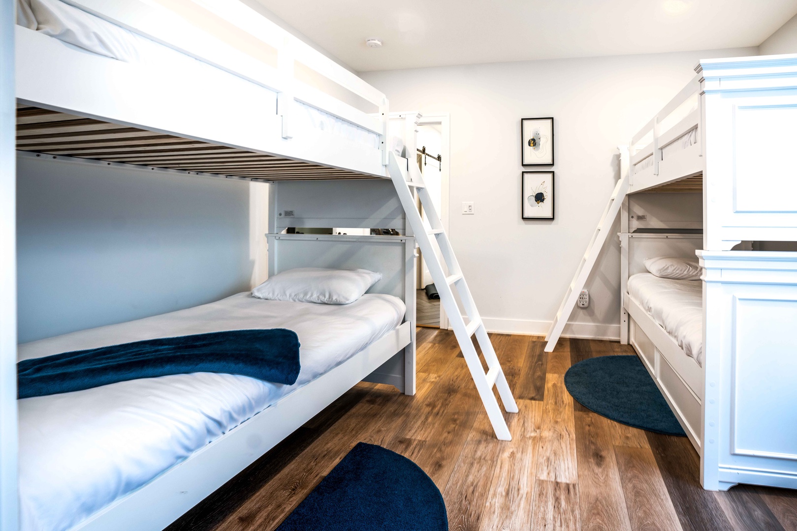 This bunk bedroom retreat offers twin bunks, a twin trundle, & Smart TV
