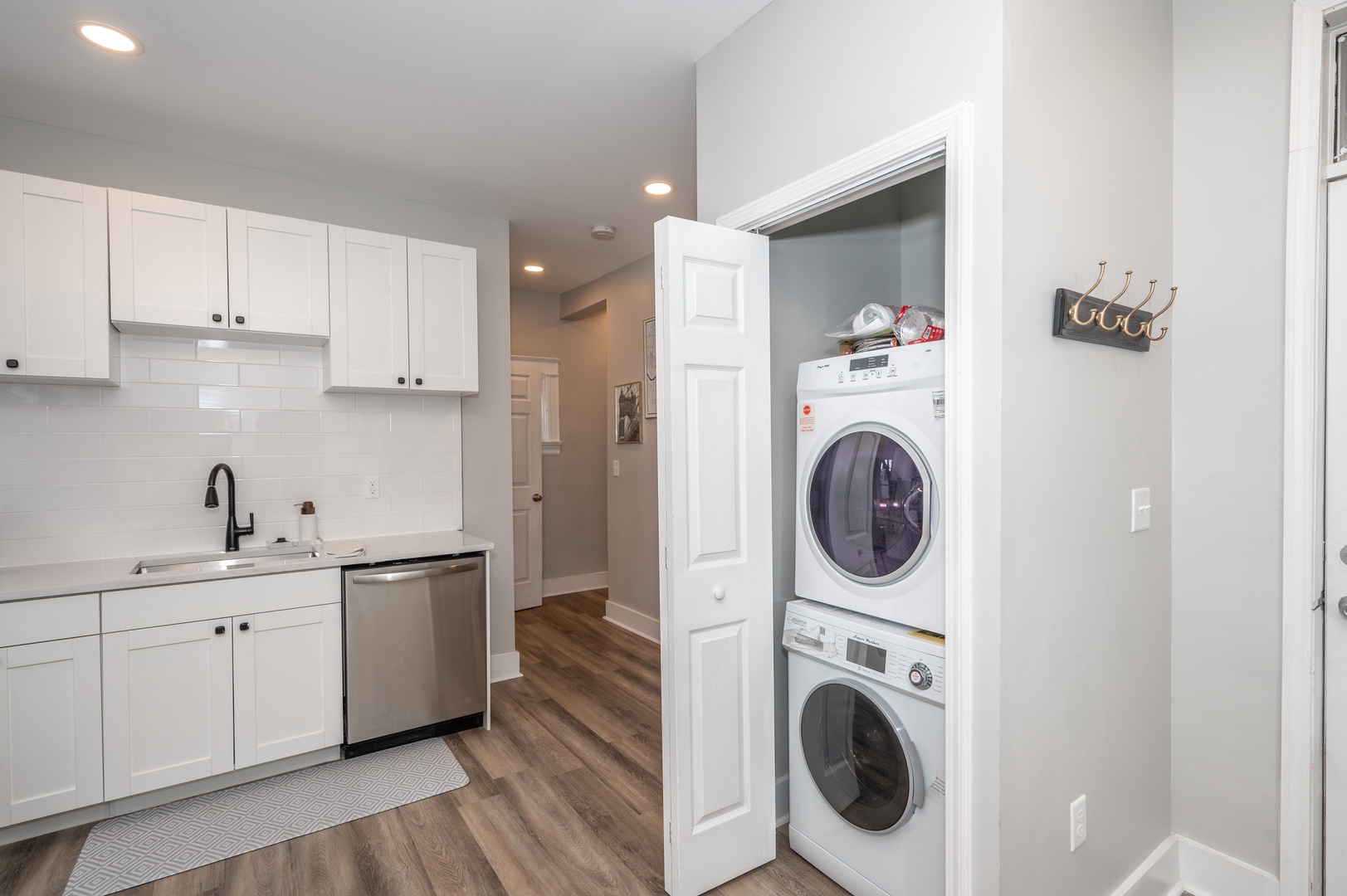 Apt 1 – Private laundry is conveniently tucked away in the kitchen