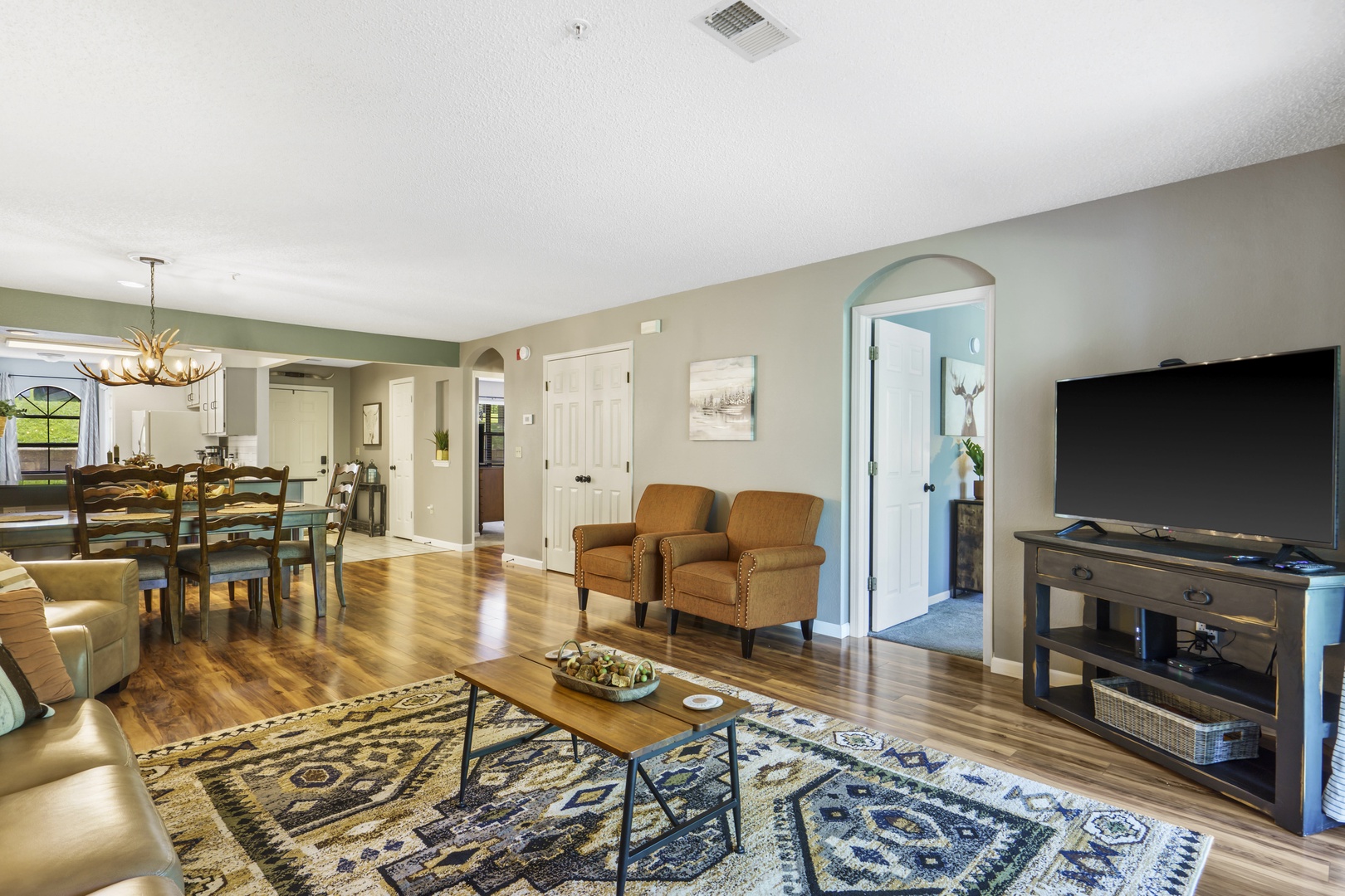 Bright living area with sofa sleeper and Smart TV