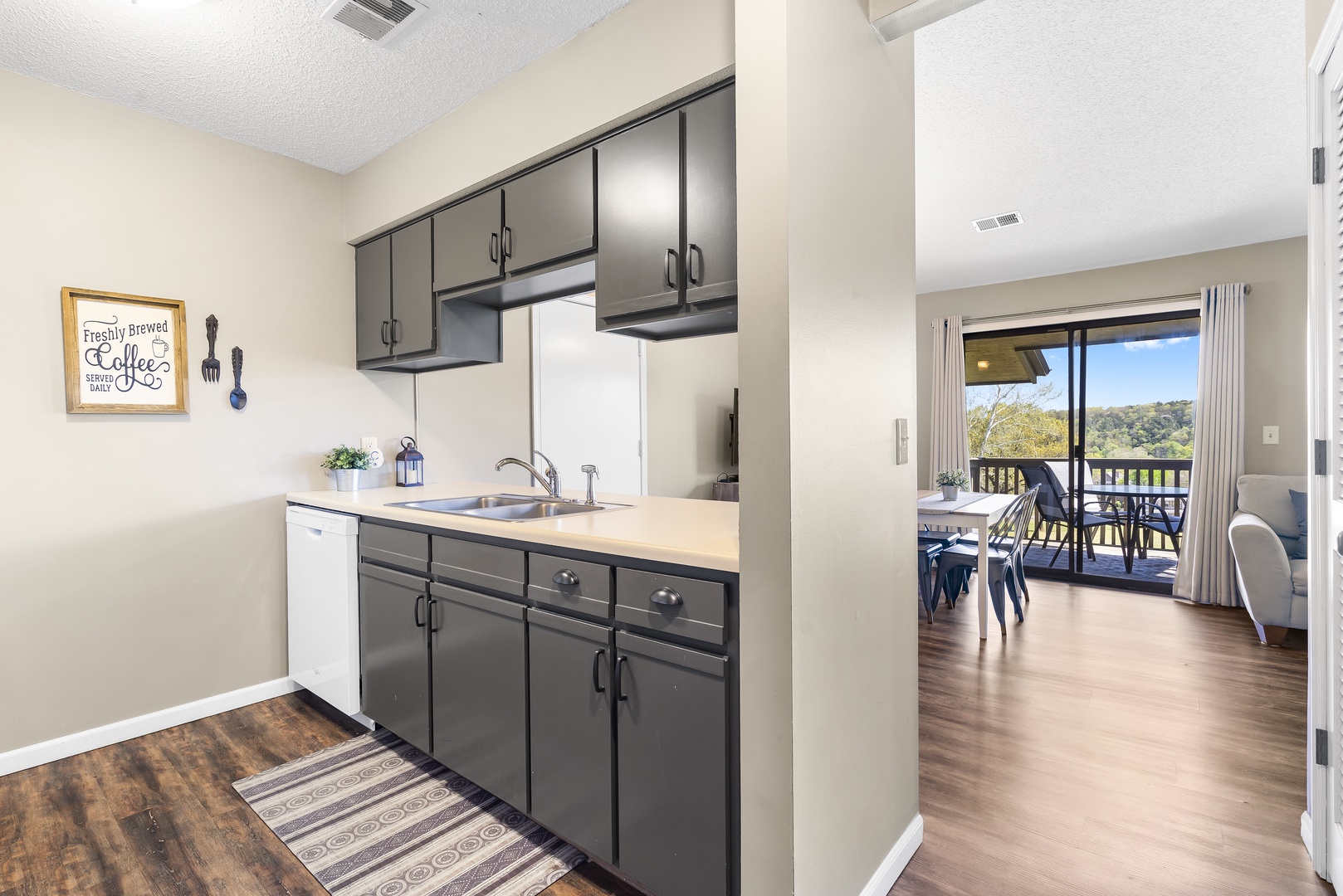 The open, airy kitchen offers ample space & all the comforts of home