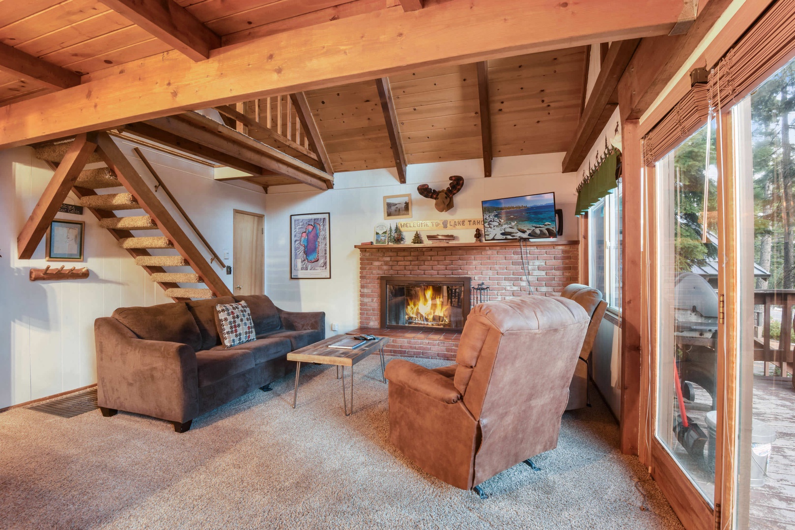 Mountain style living room with fireplace, flat screen TV, wifi, and DVD player