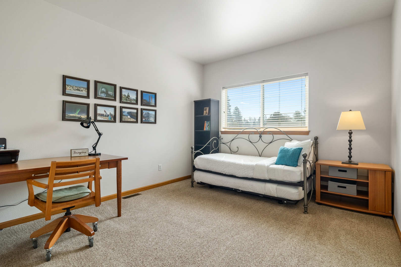 This 2nd floor bedroom offers a twin bed, twin trundle, and desk workspace