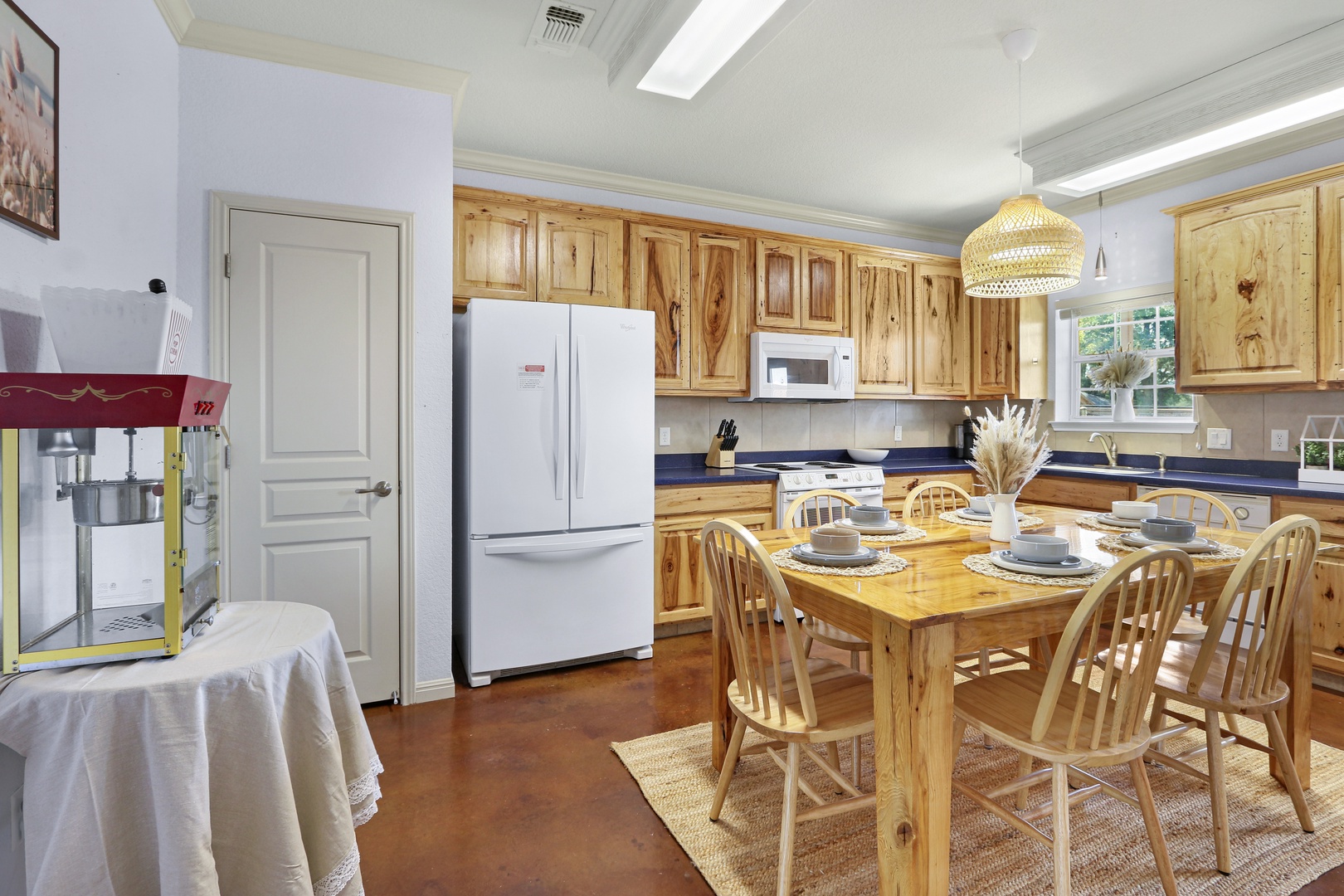 The spacious eat-in kitchen is well equipped for your visit to New Braunfels