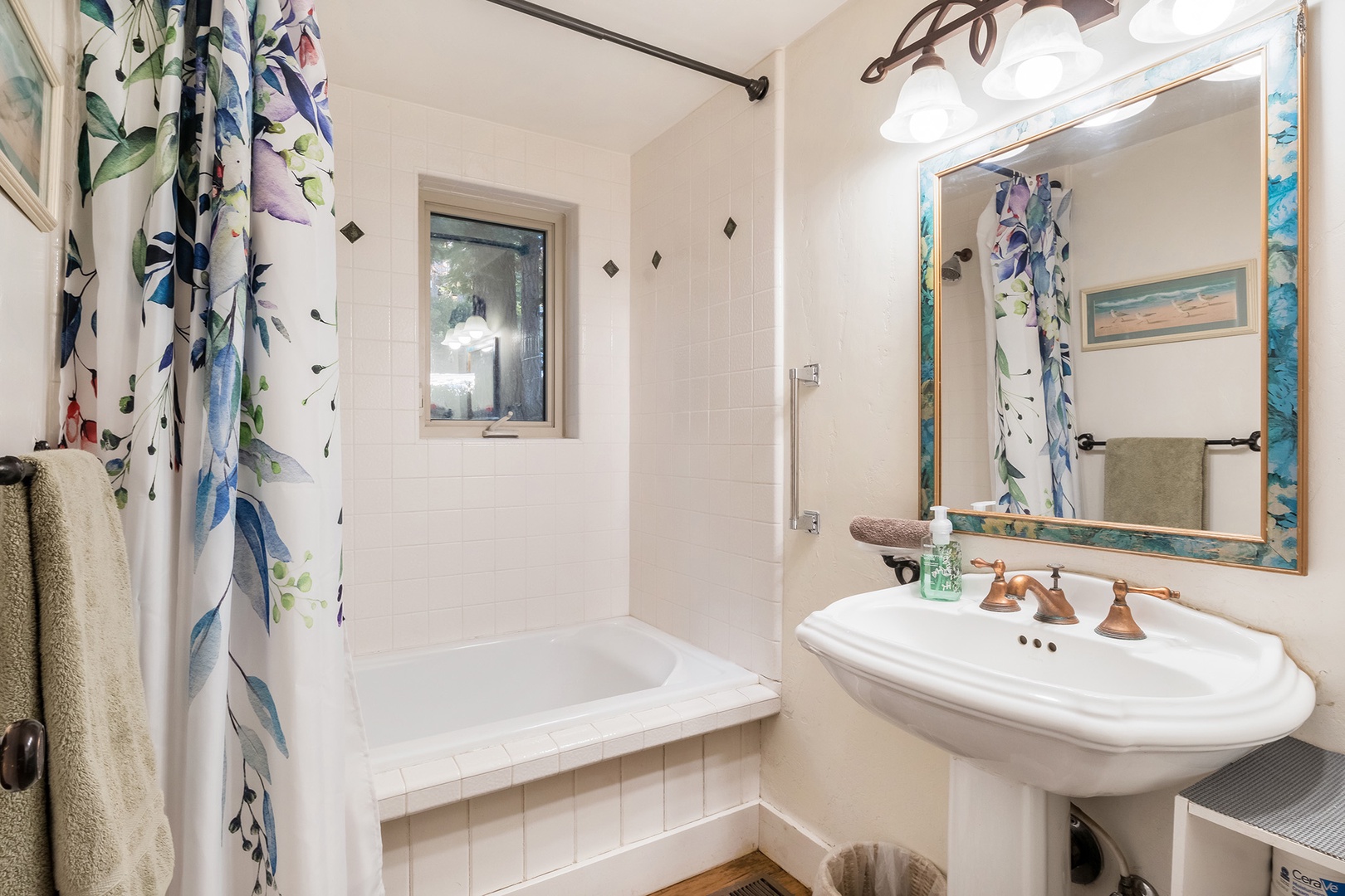 Wash up in this 2nd-floor full bath, with a vanity & shower/tub combo