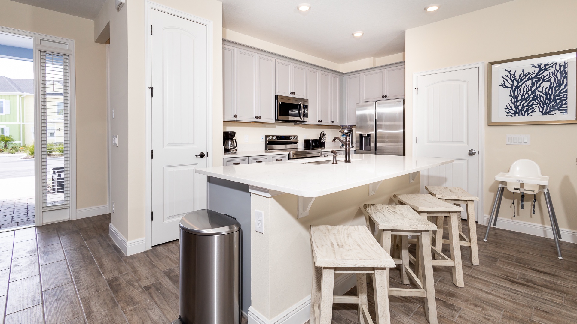 Sip morning coffee or enjoy a snack at the kitchen counter, with seating for 4