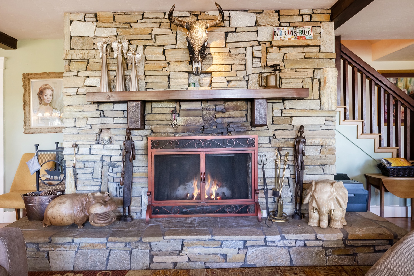 Mountain style living room with fireplace, smart TV and games