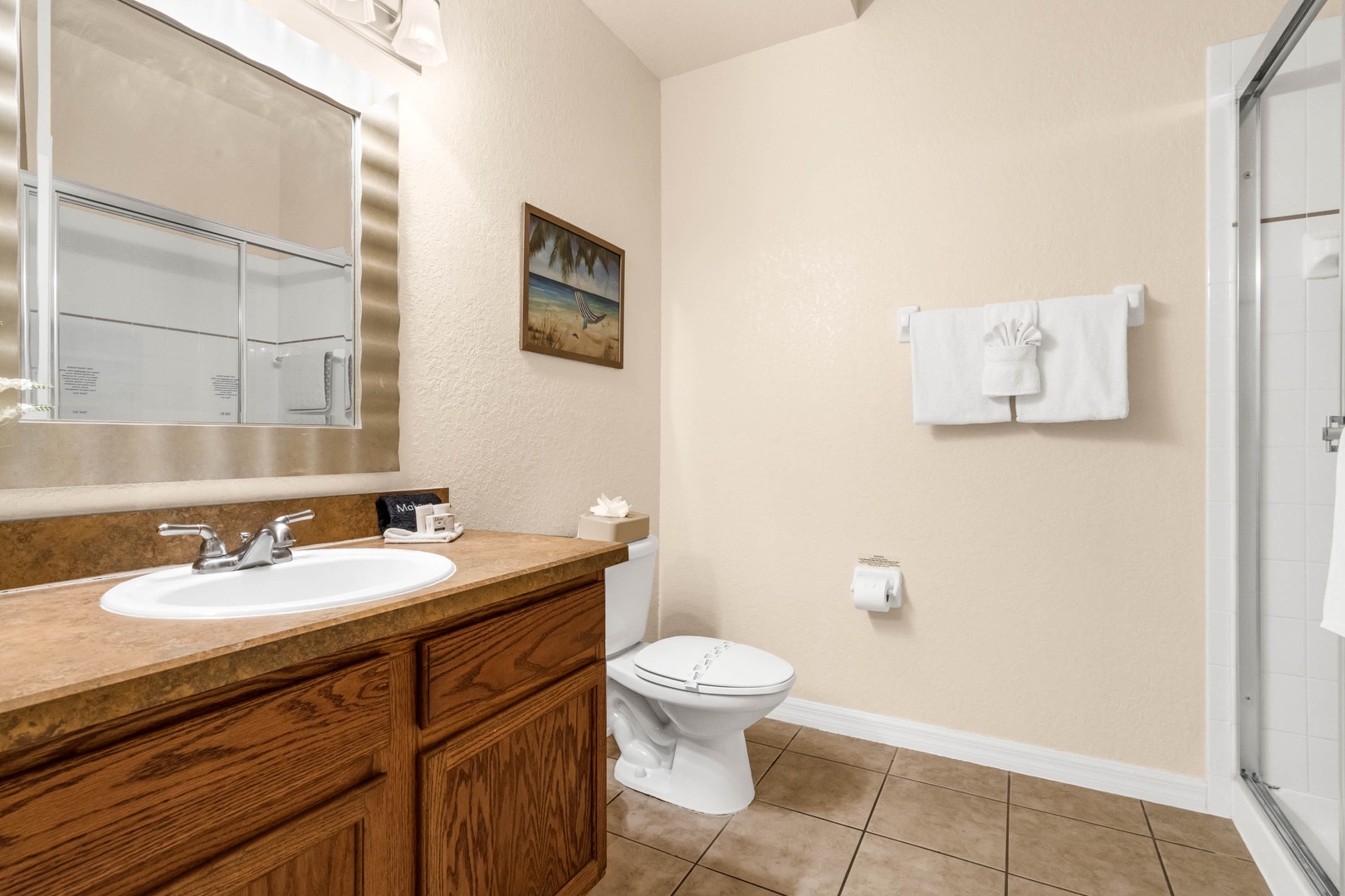 Find a spacious single vanity and shower in the shared bathroom