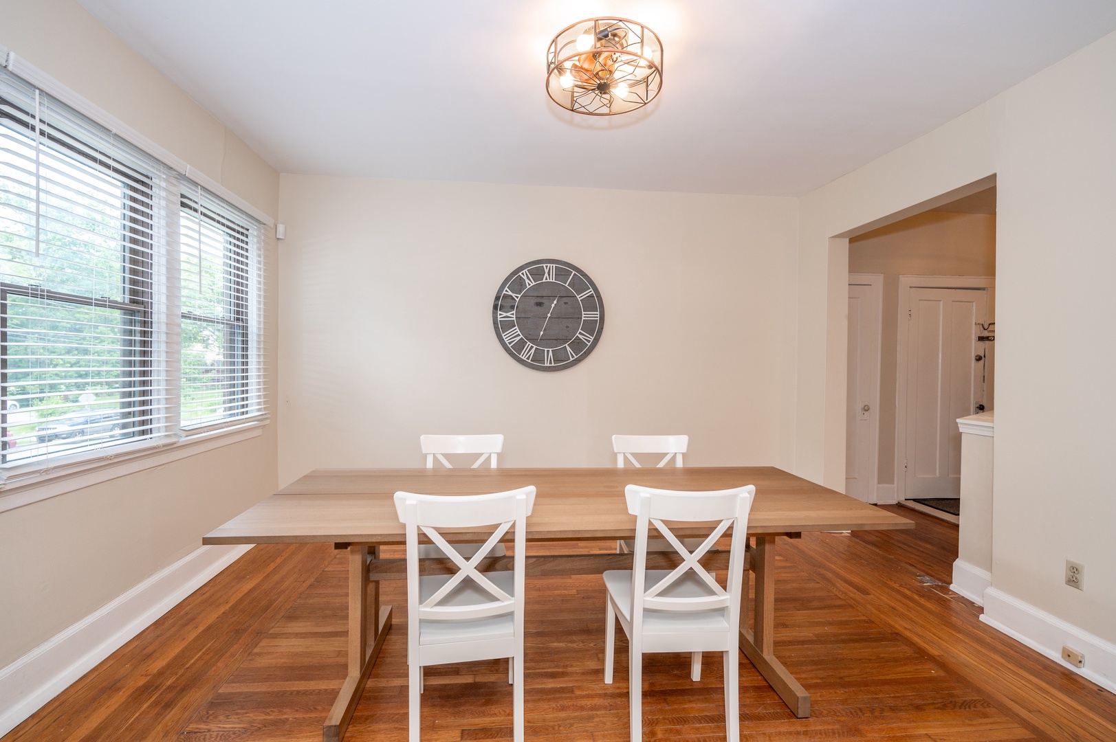 Gather for meals together at the dining table, offering seating for 4