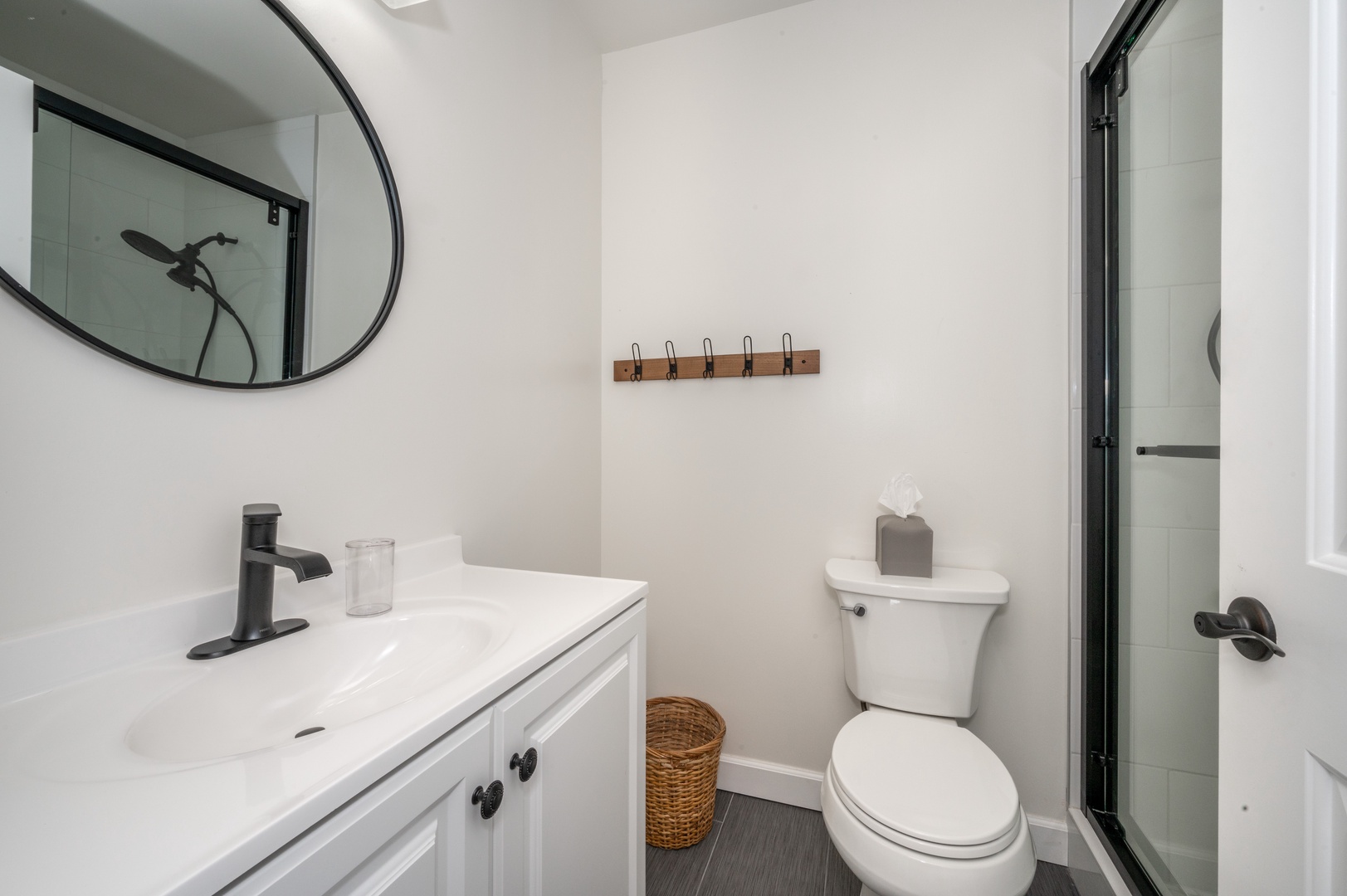 The sleek full bath in Apartment B features a single vanity & shower