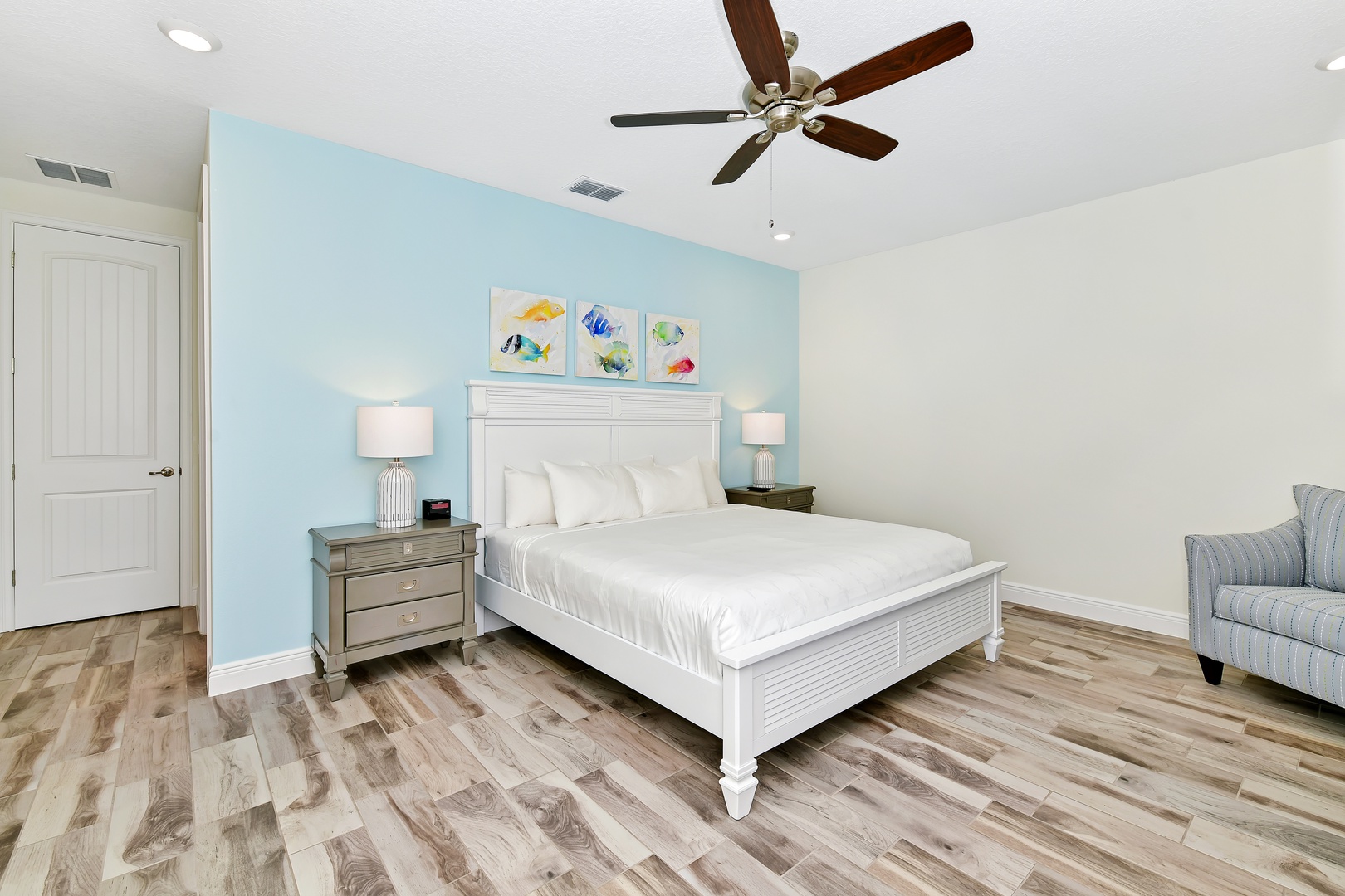 2nd Floor Master featuring a cozy king bed, ceiling fan and private ensuite