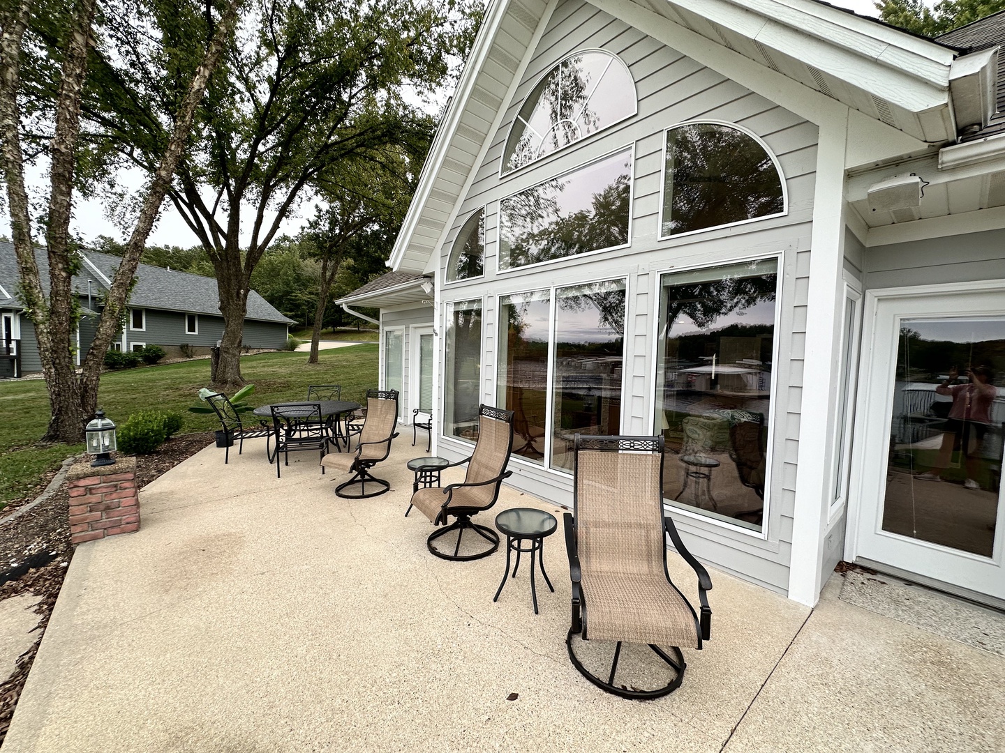 Patio with outdoor seating grill, and lake view