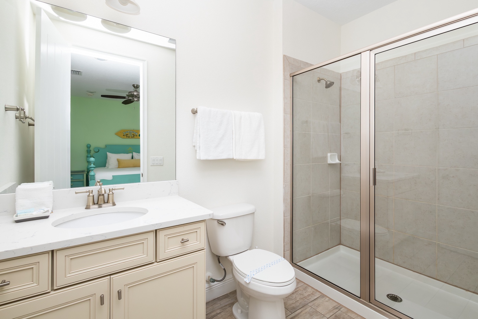 A single vanity & shower await in this ensuite bath to 3rd floor king (front) bedroom