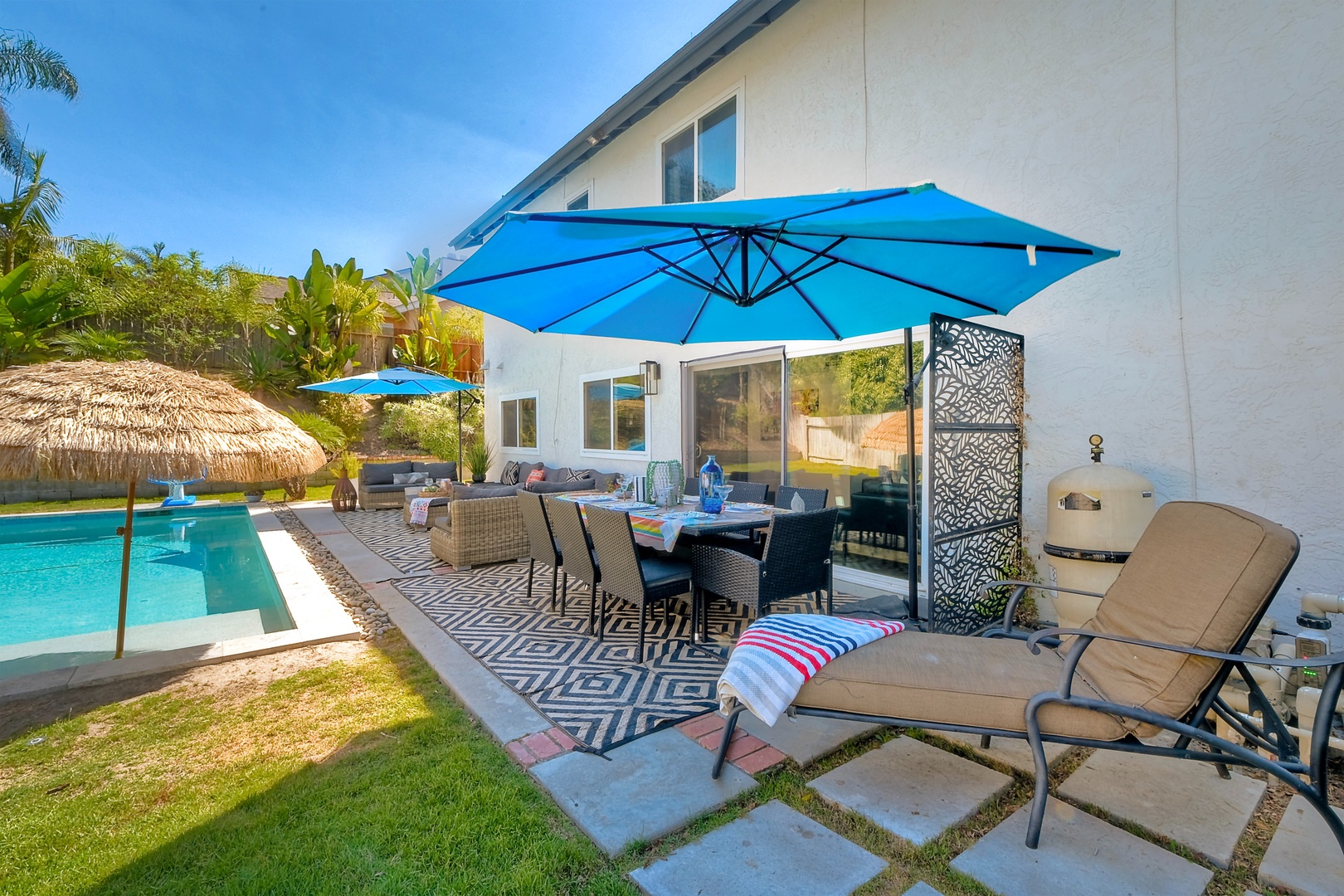 Backyard with ample seating and private pool