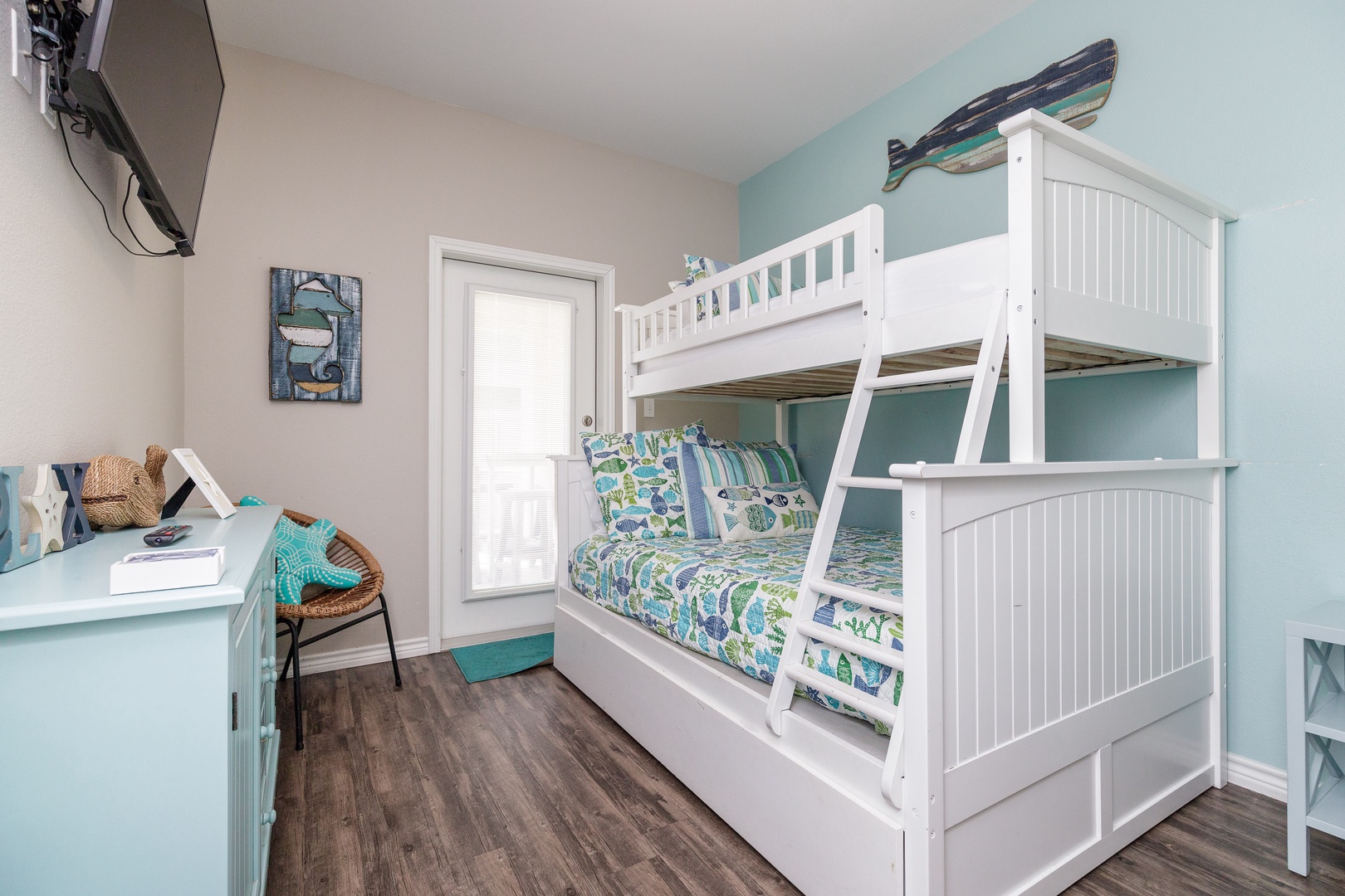 The 3rd of 3 bedrooms on the 1st floor offers twin-over full bunks & Smart TV