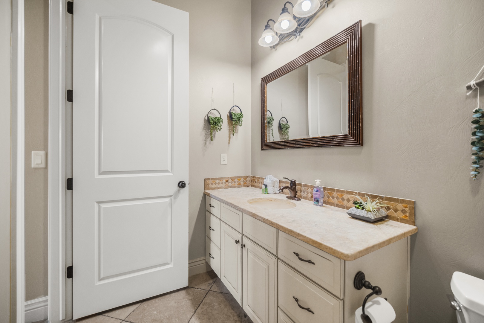 The shared main floor full bath includes a single vanity & shower/tub combo