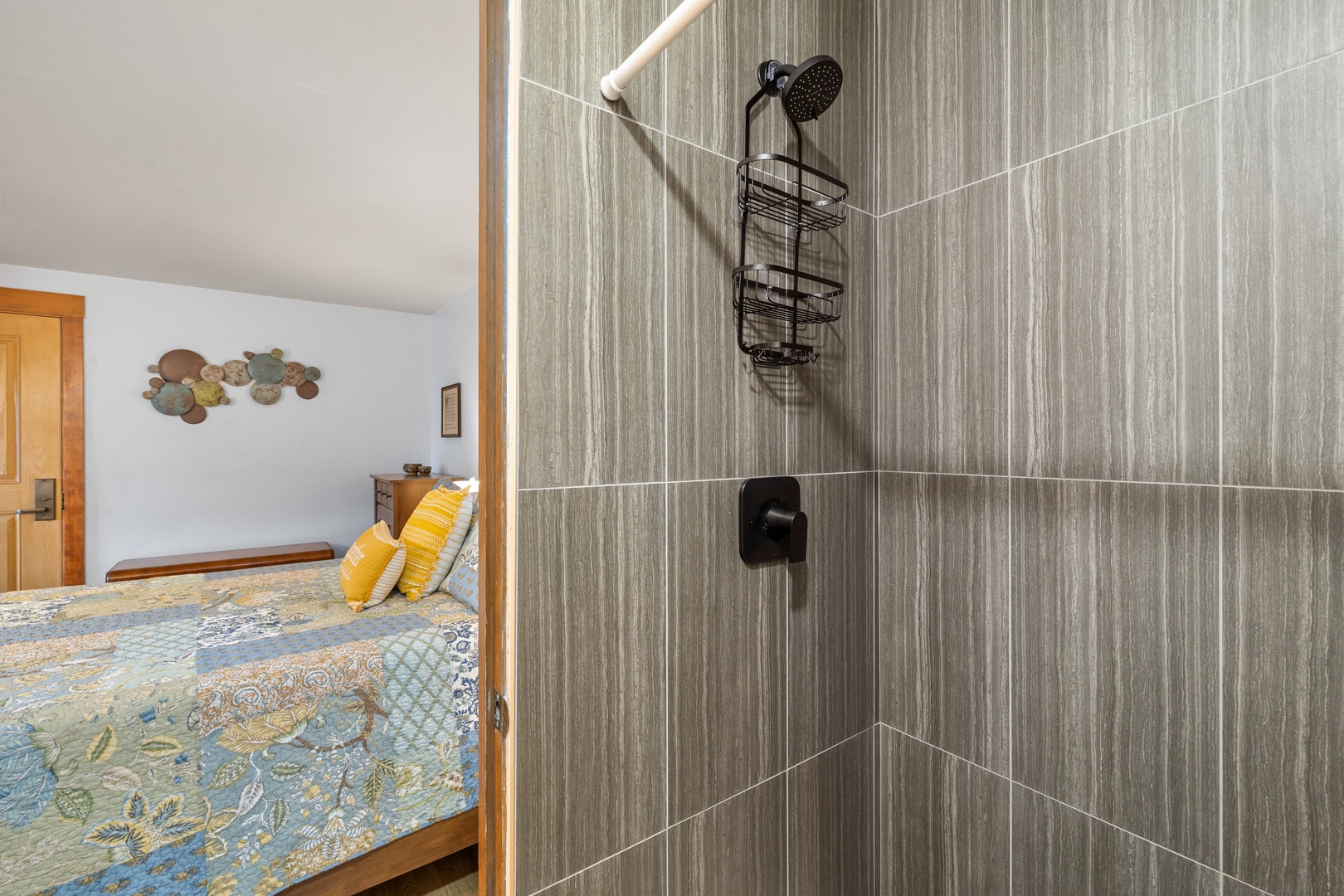 The queen en suite bathroom offers a large single vanity & walk-in shower