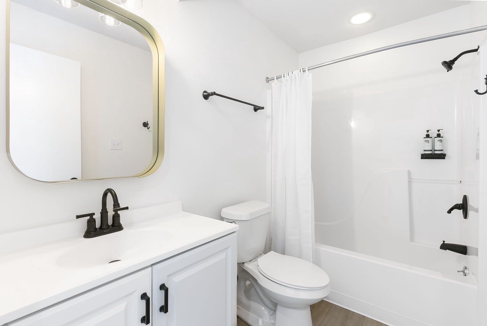 The hall bath on the 2nd floor includes a single vanity & shower/tub combo