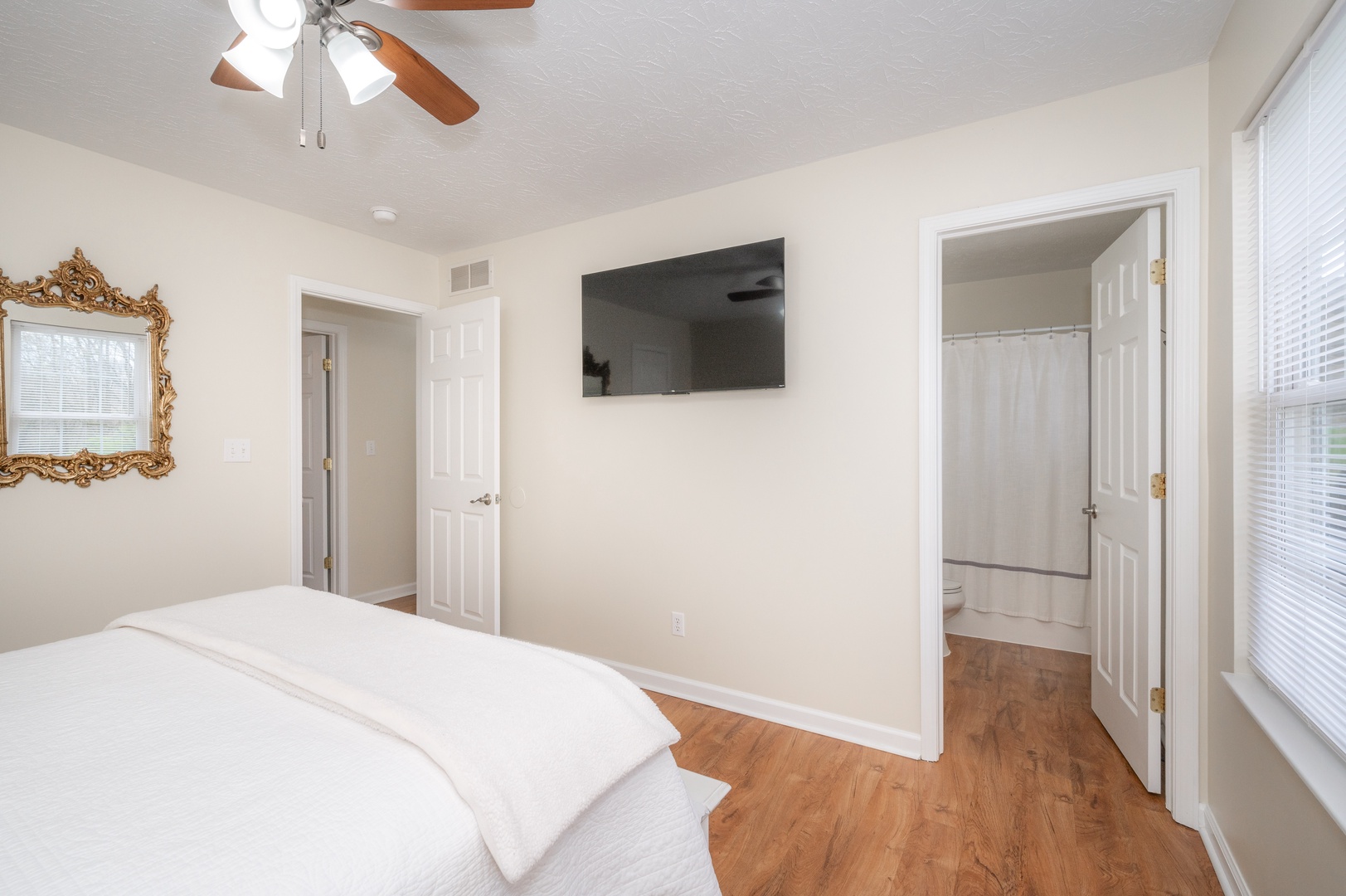 The upper-level queen suite boasts a Smart TV & private ensuite