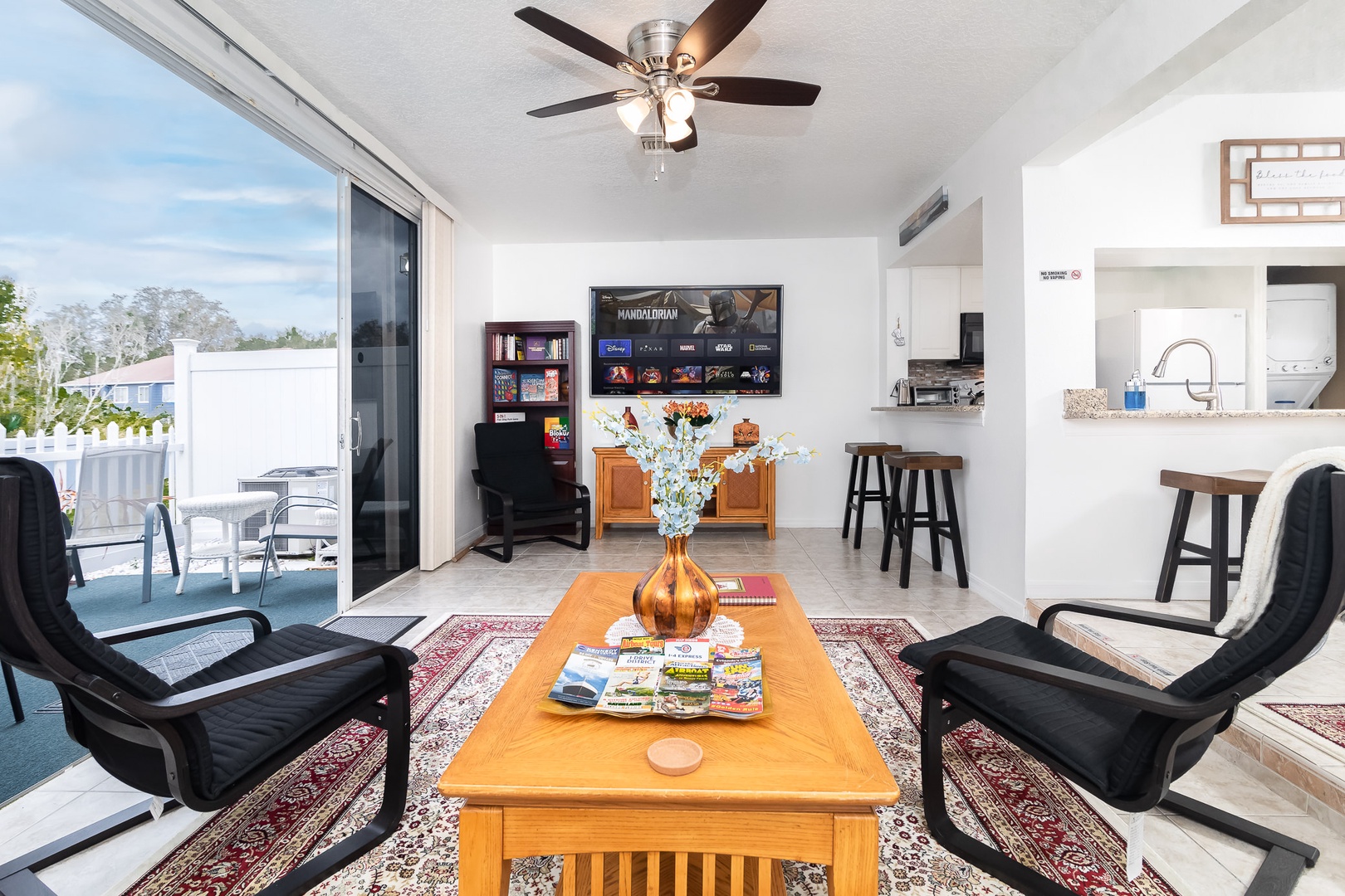 Living room includes entertainment shelf and smart TV