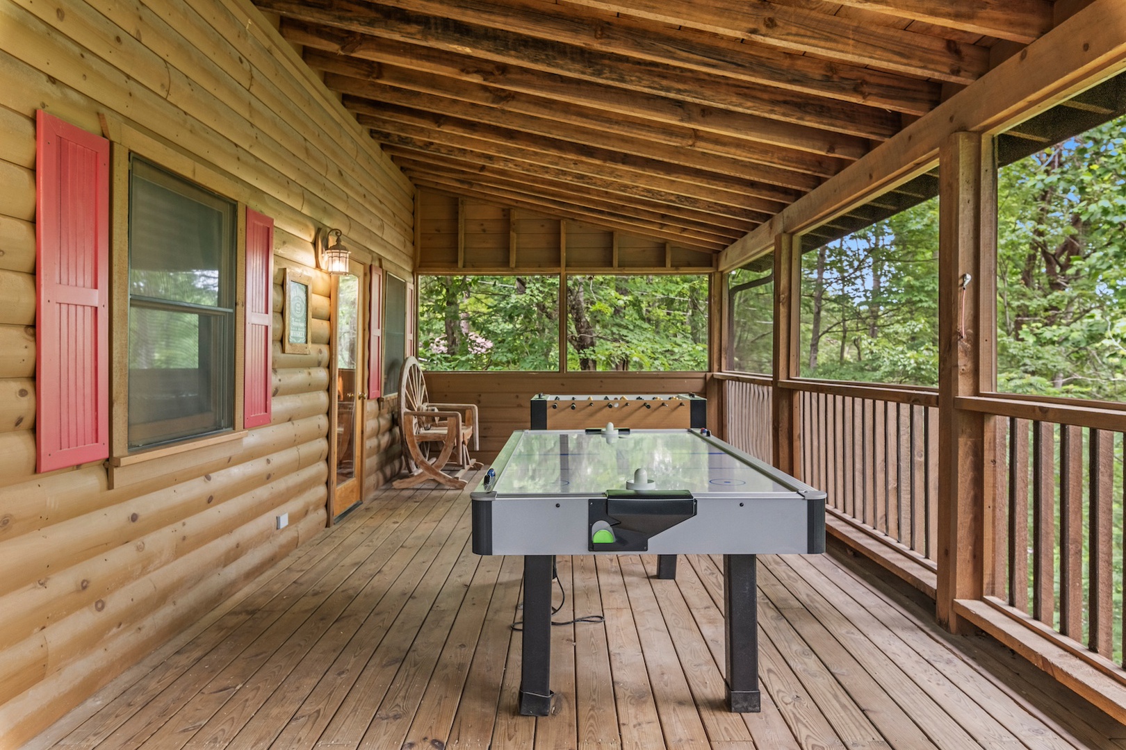 Additional covered deck with outdoor seating, foosball, and air hockey