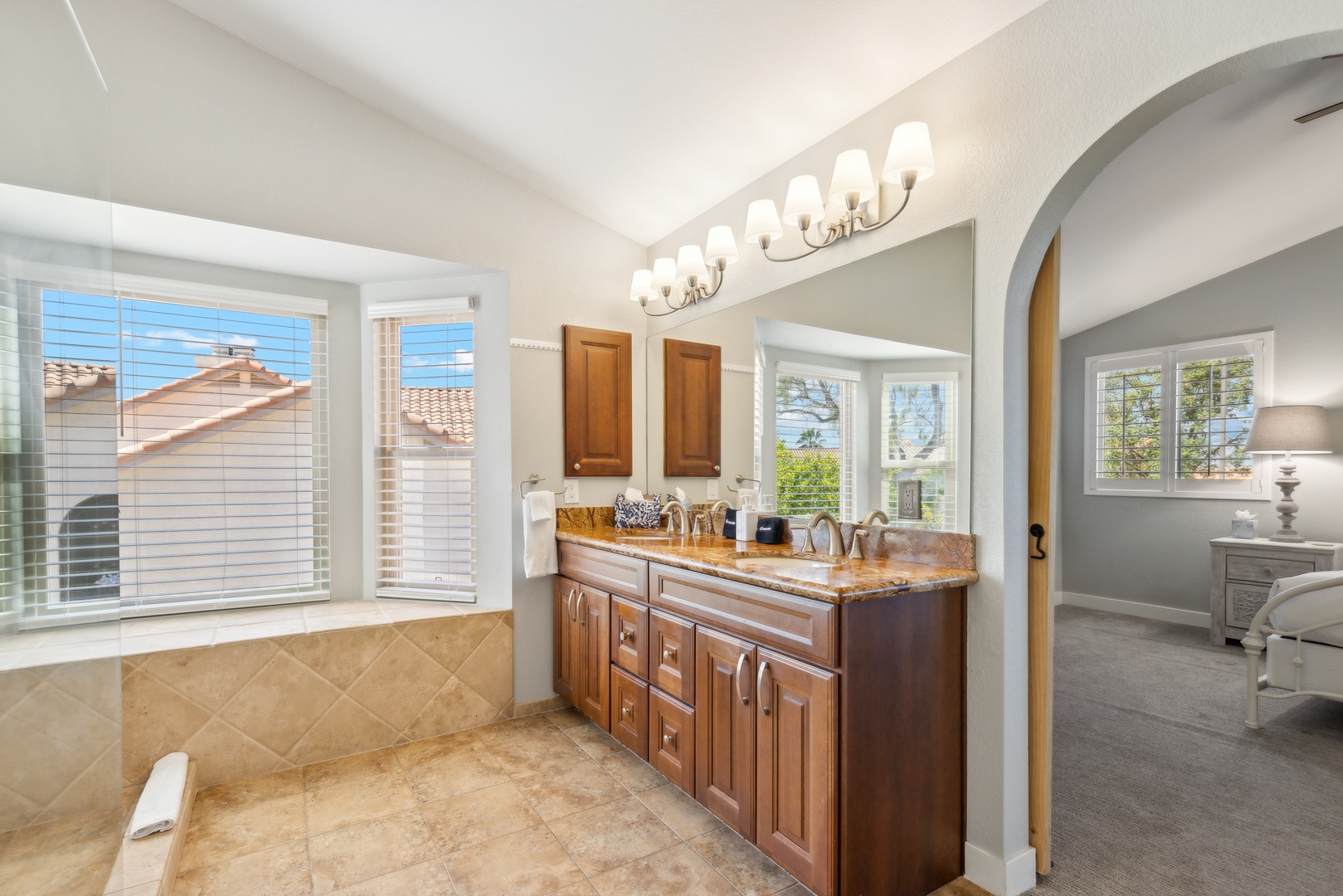 Ensuite bathroom with dual sinks, and walk-in shower with dual shower heads