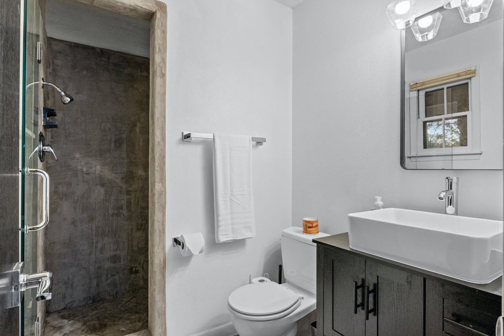This private ensuite offers a single vanity & walk-in shower