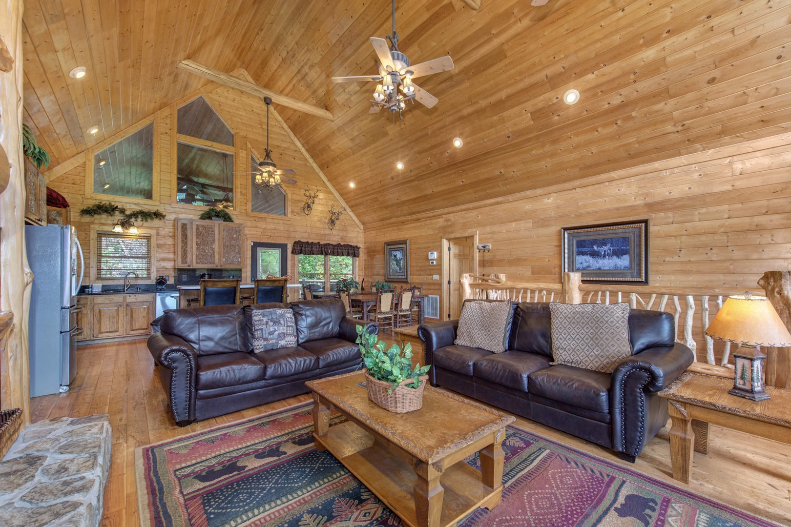 Gather around in the spacious living room with ample seating, gas fireplace, and Smart TV