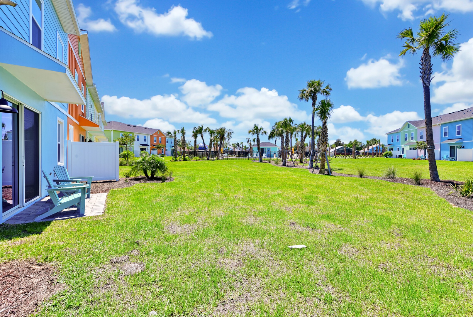 Adirondack chairs, swaying palms, and endless views