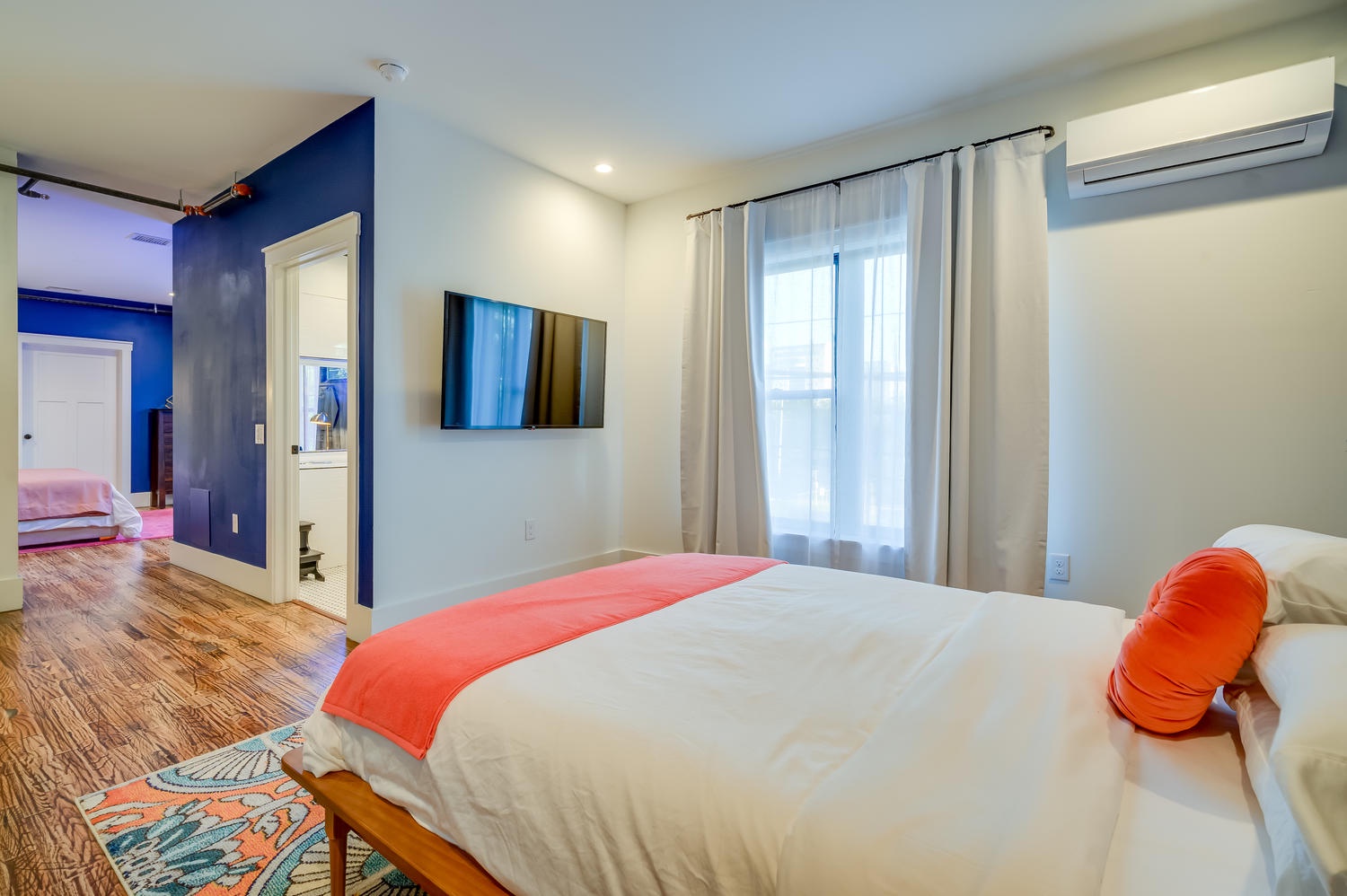 Suite 203 – The 2nd Floor Blue Mid-Century Suite offers Casper King and Queen Beds, Smart TV, and En Suite Bathroom