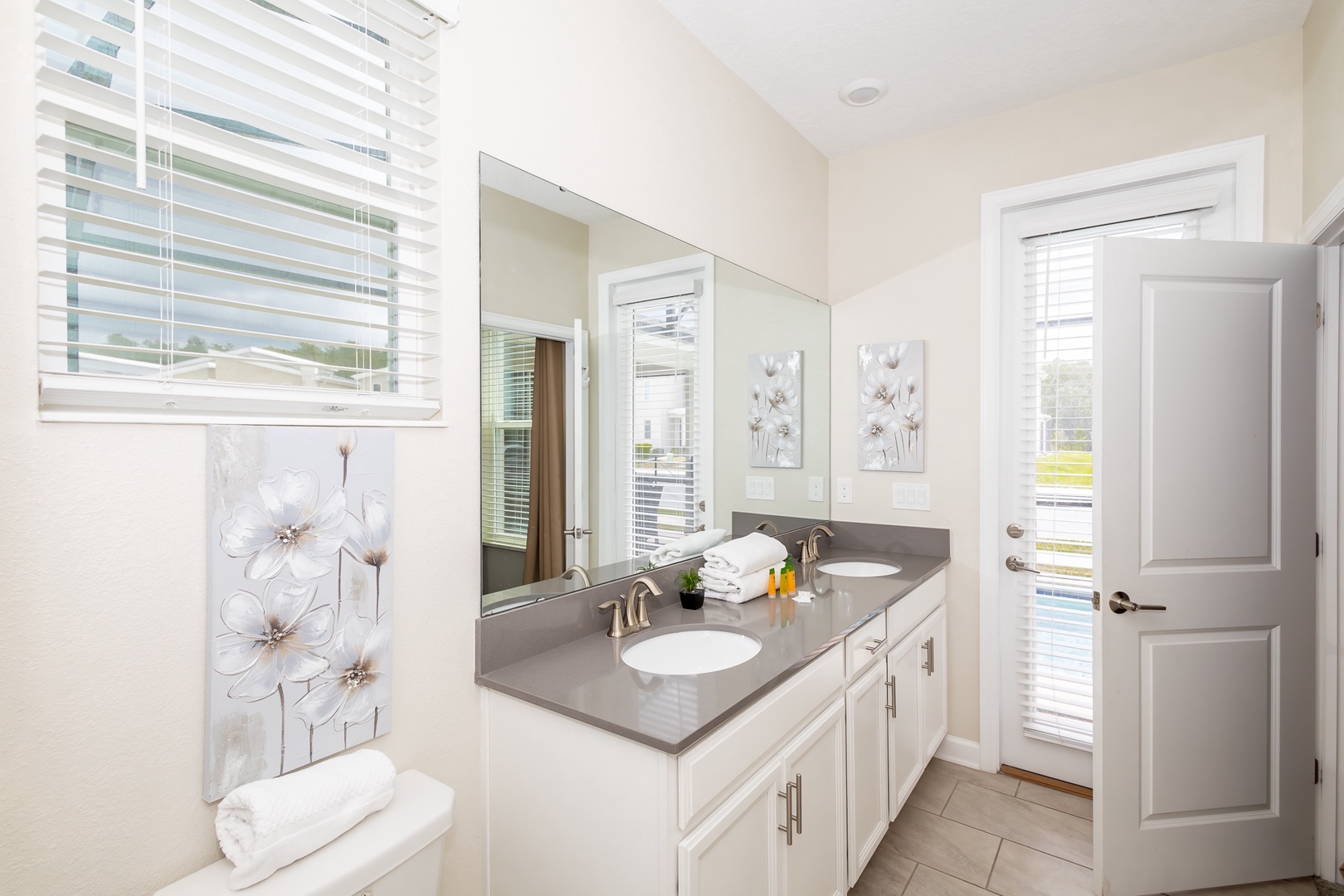 Wash up in this king ensuite, featuring a double vanity & glass shower