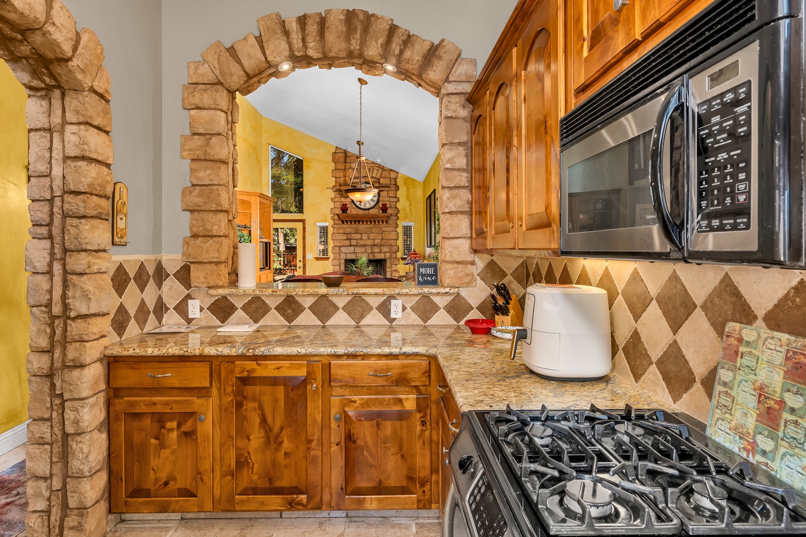 The gorgeous kitchen offers ample space & all the comforts of home