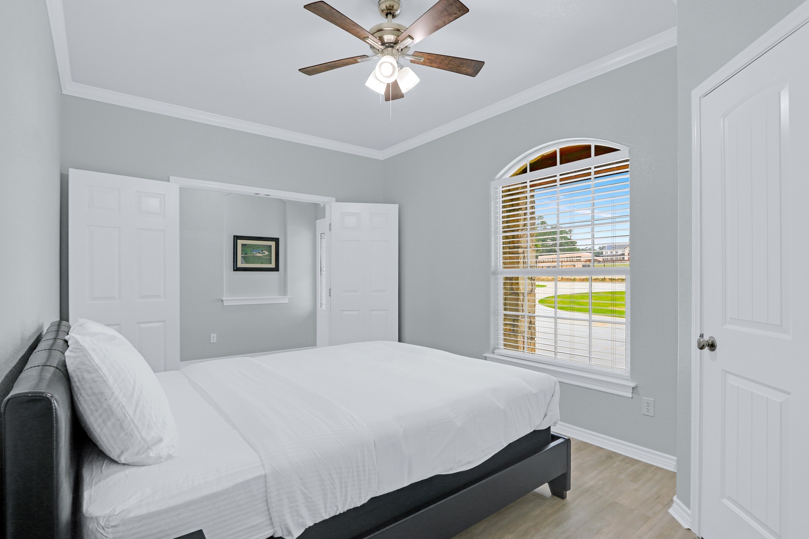 Take in the view in this serene bedroom, which includes a cozy queen bed