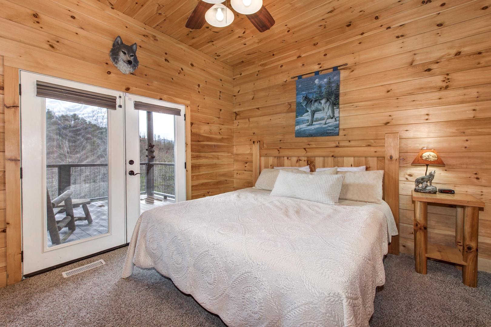 The final lower-level suite boasts a cozy king bed, ensuite bath, & Smart TV