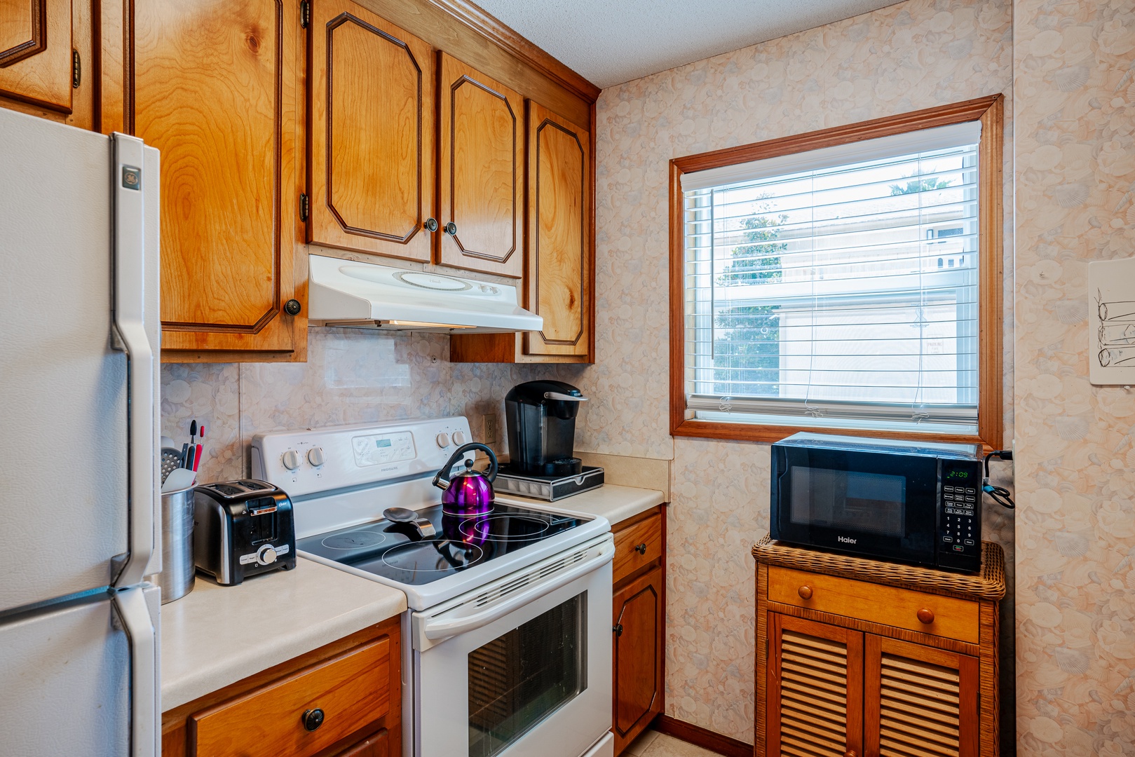 An open, airy kitchen equipped with all the comforts of home