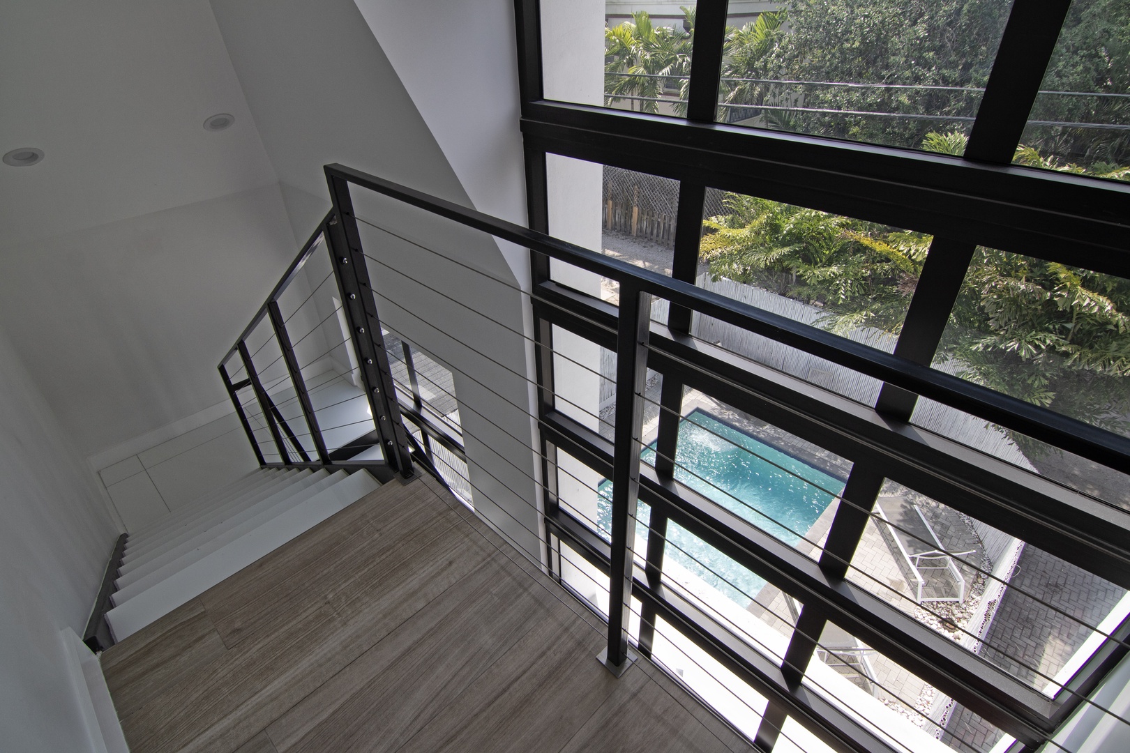 View of Private Pool from Interior Staircase