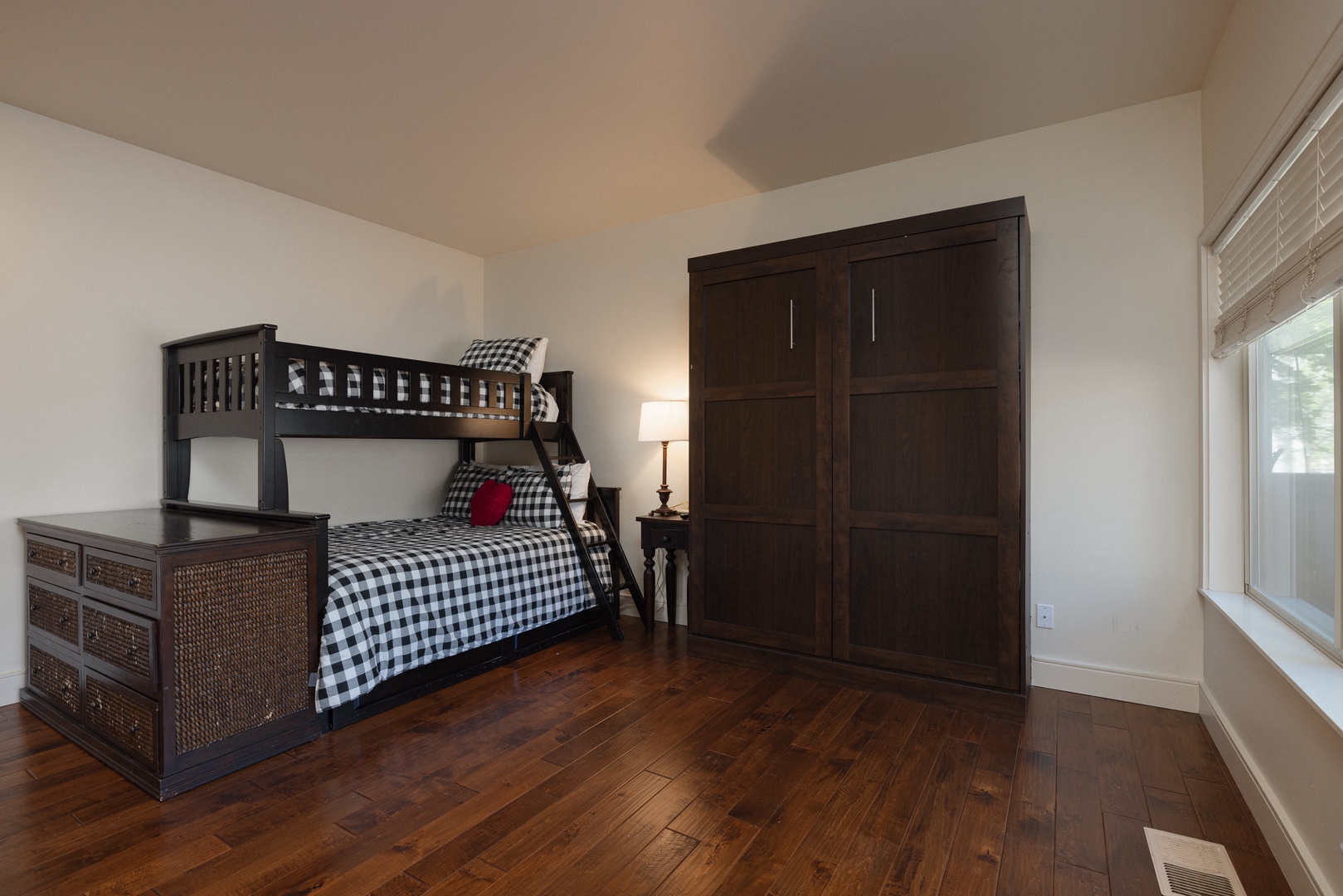 This 1st-floor suite offers a twin-over-full bunkbed & queen Murphy bed