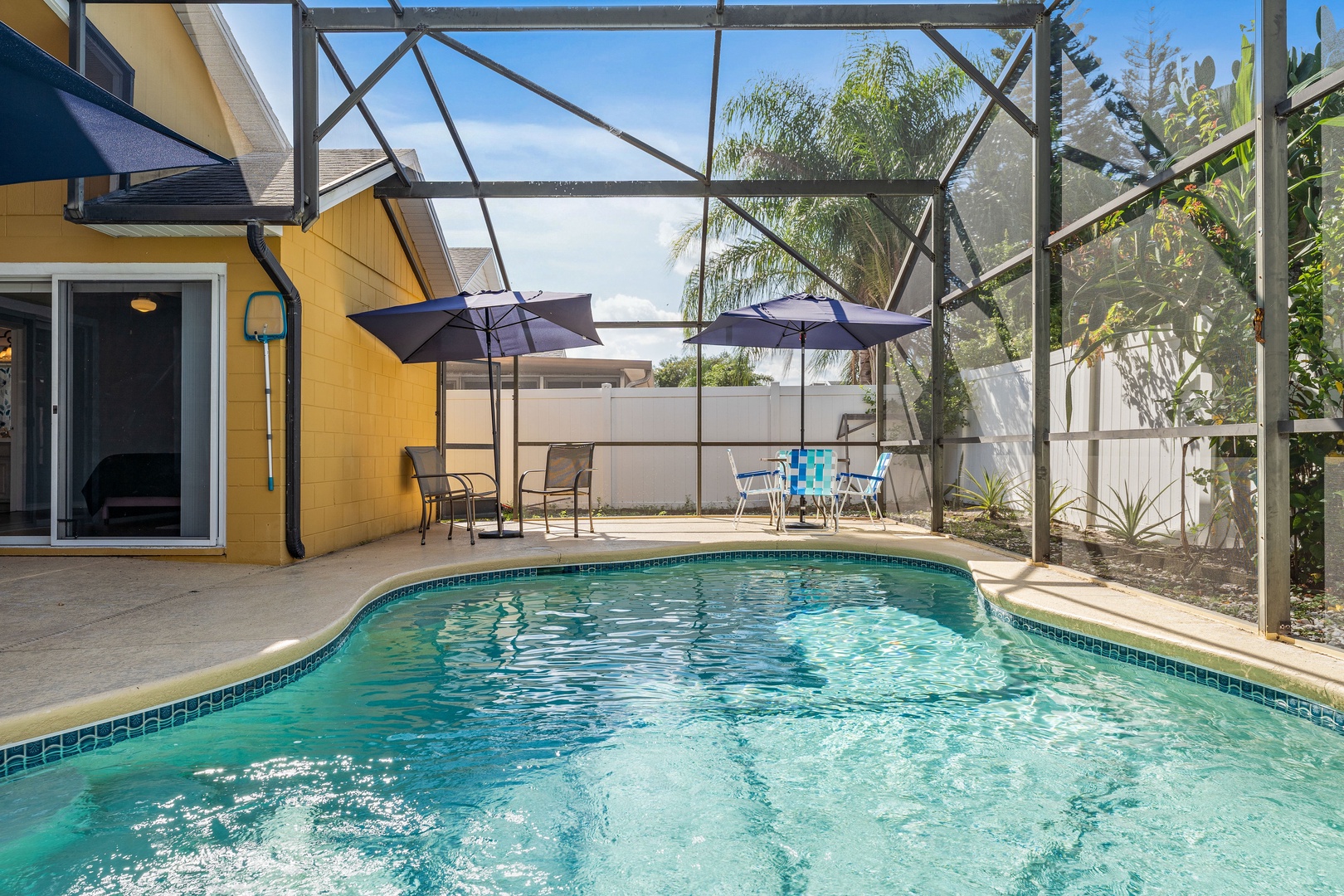 Screened in pool with outdoor seating