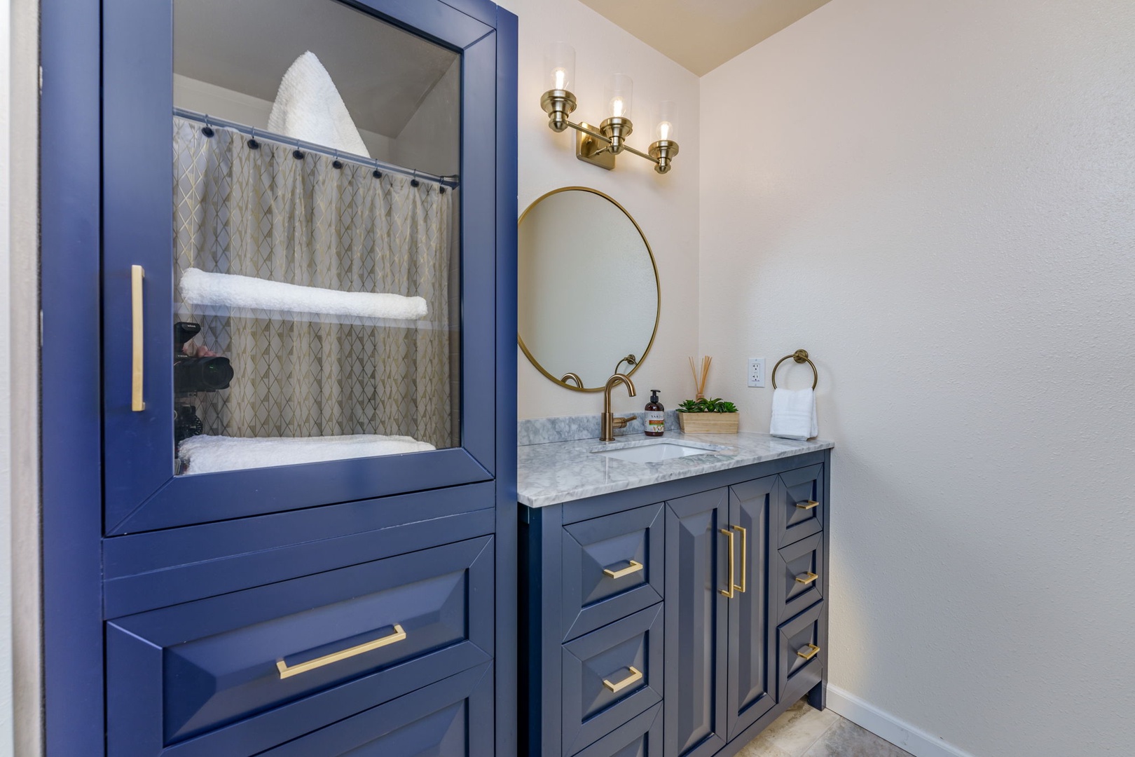 The shared Bathroom offers beautiful finishes, generous storage space, and a Shower/Tub Combo