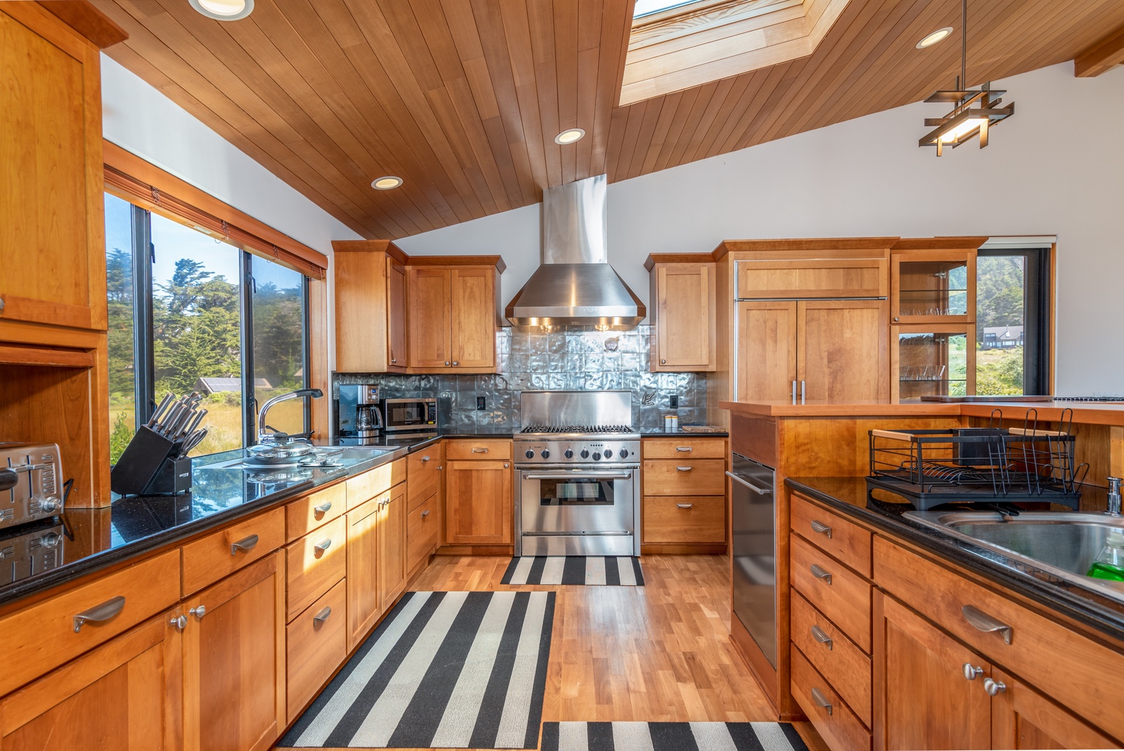 Gourmet kitchen with coffee maker, cookware, dishes and more